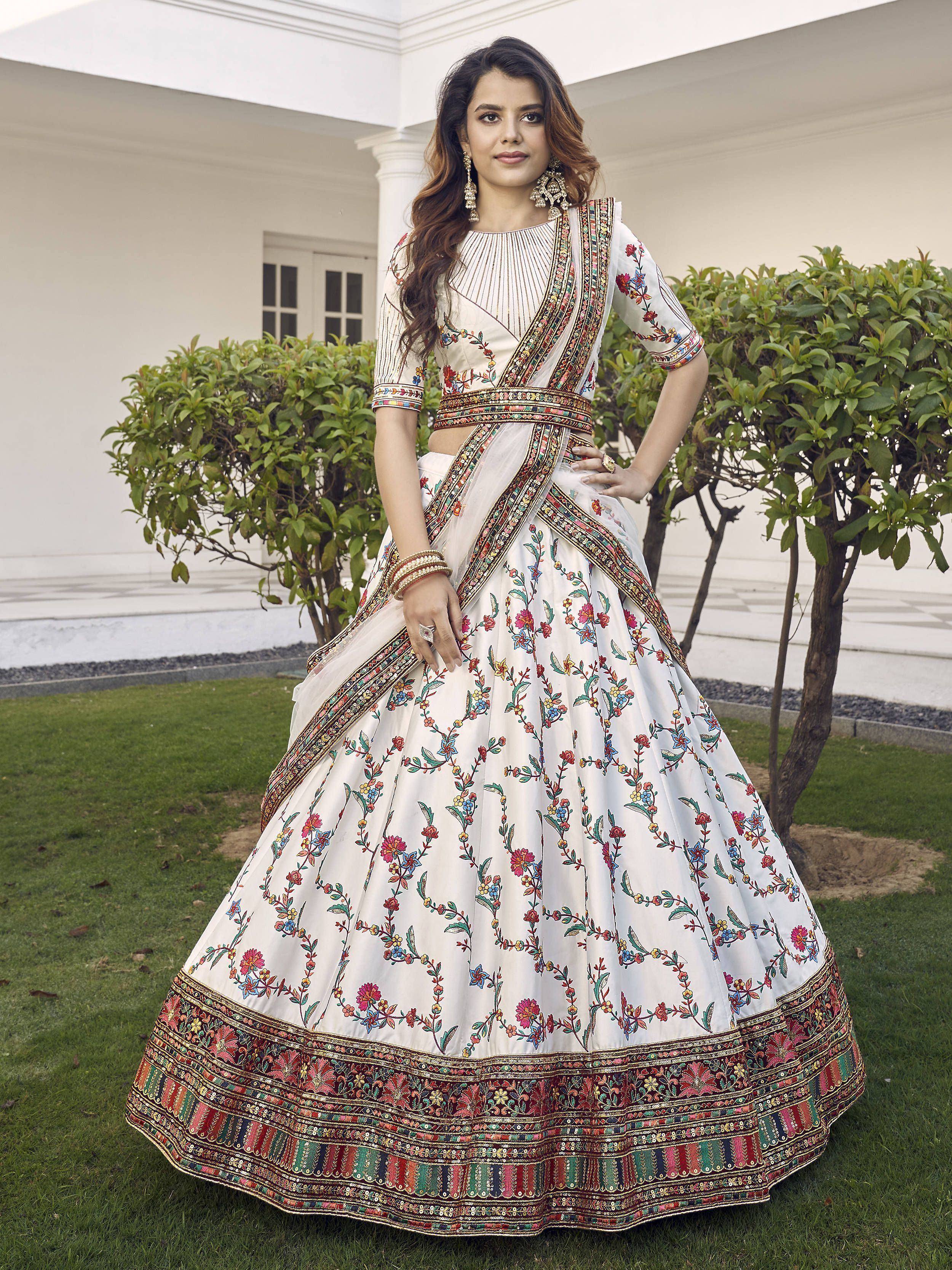 White floral embroidered lehenga choli with colorful border, perfect for Indian ethnic occasions