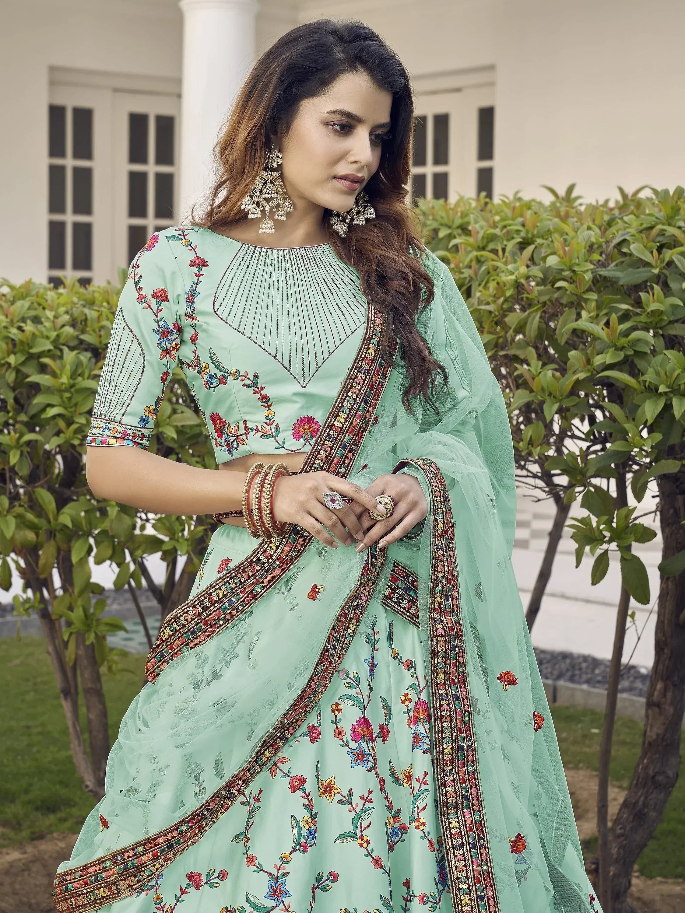 Spectacular Pista Green Thread Embroidered Silk Wedding Wear Lehenga Choli