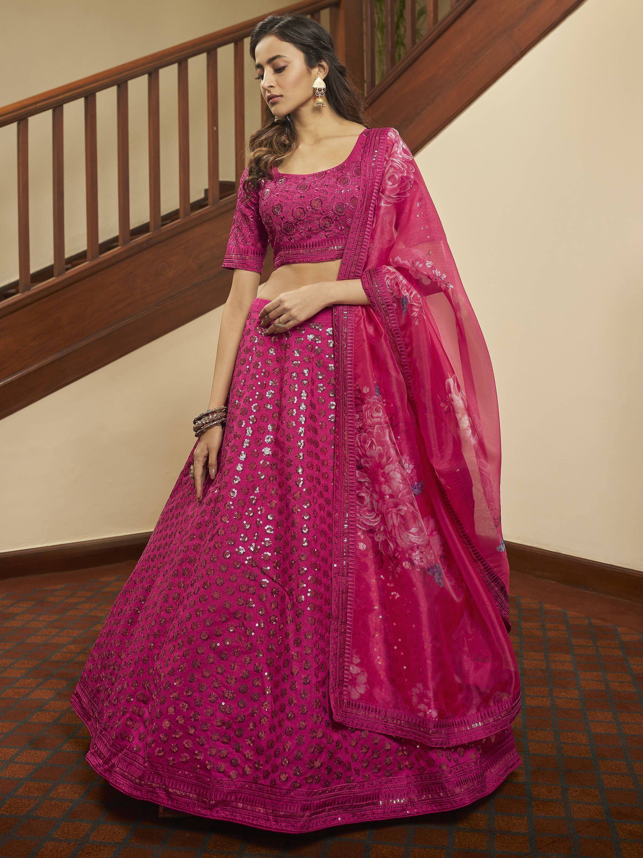 Fuchsia pink designer lehenga choli with floral embroidery and sequins, perfect for Indian ethnic wear occasions.