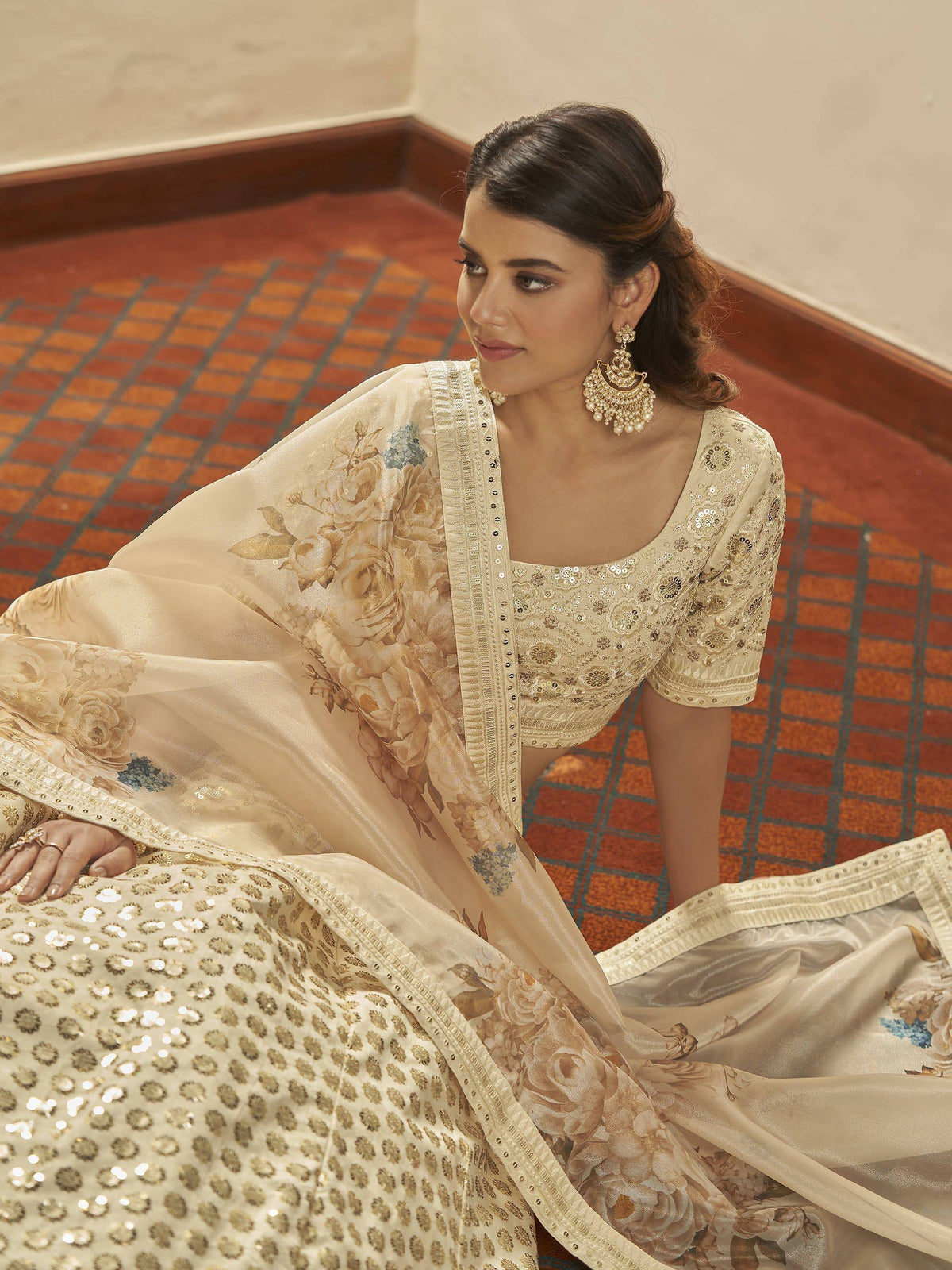 Elegant cream lehenga choli with floral dupatta and gold sequin work, perfect for Indian ethnic occasions