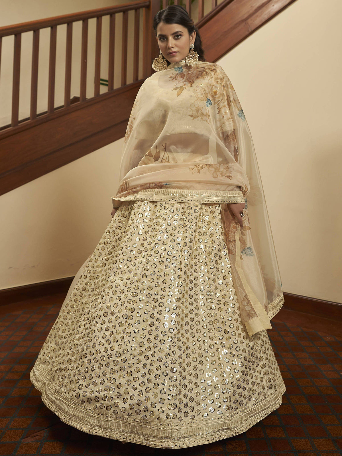 Elegant beige lehenga choli with gold sequin work and floral dupatta, perfect for Indian ethnic occasions.