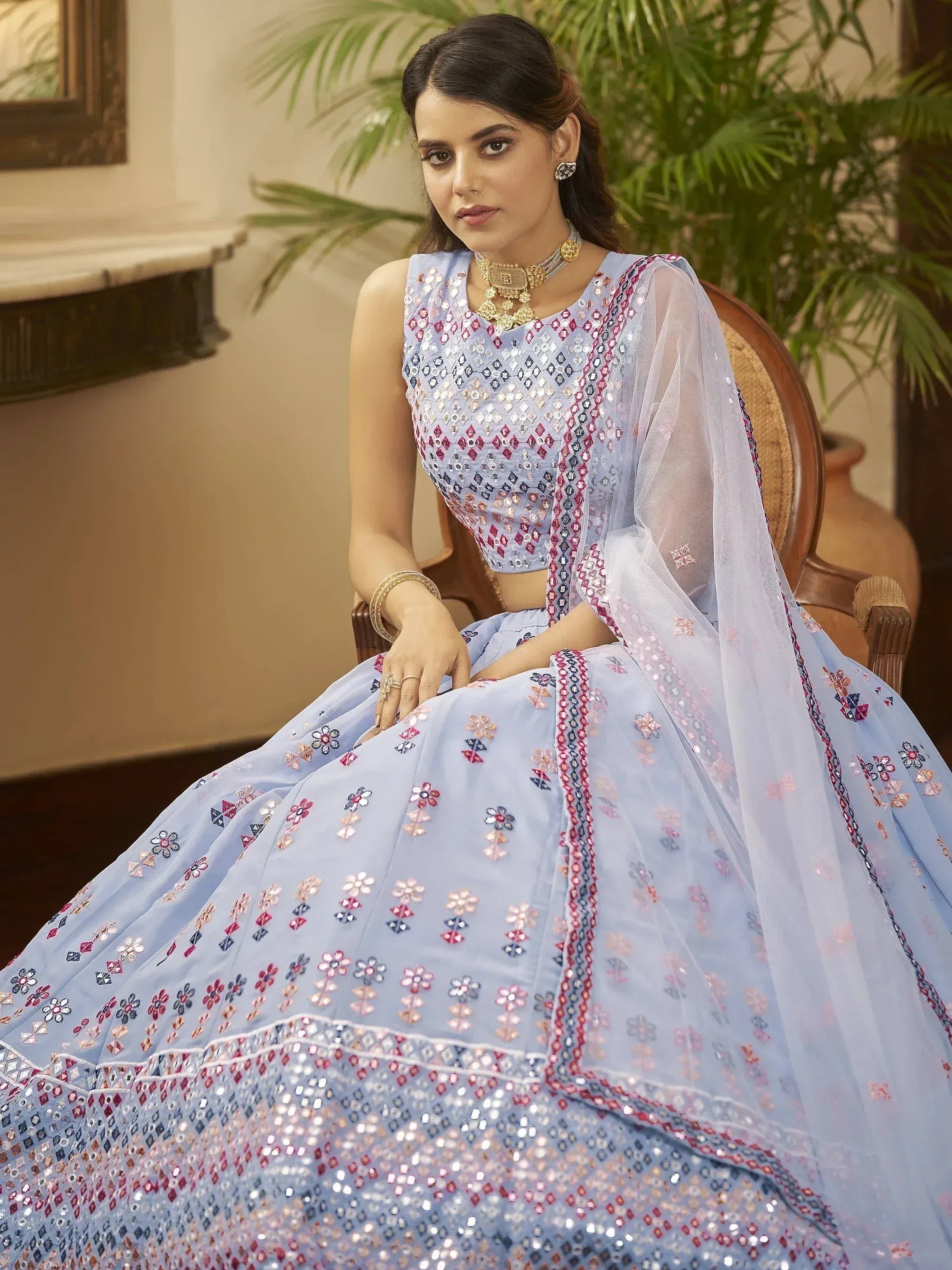 Light blue designer lehenga choli with mirror work and floral embroidery, perfect for Indian ethnic wear