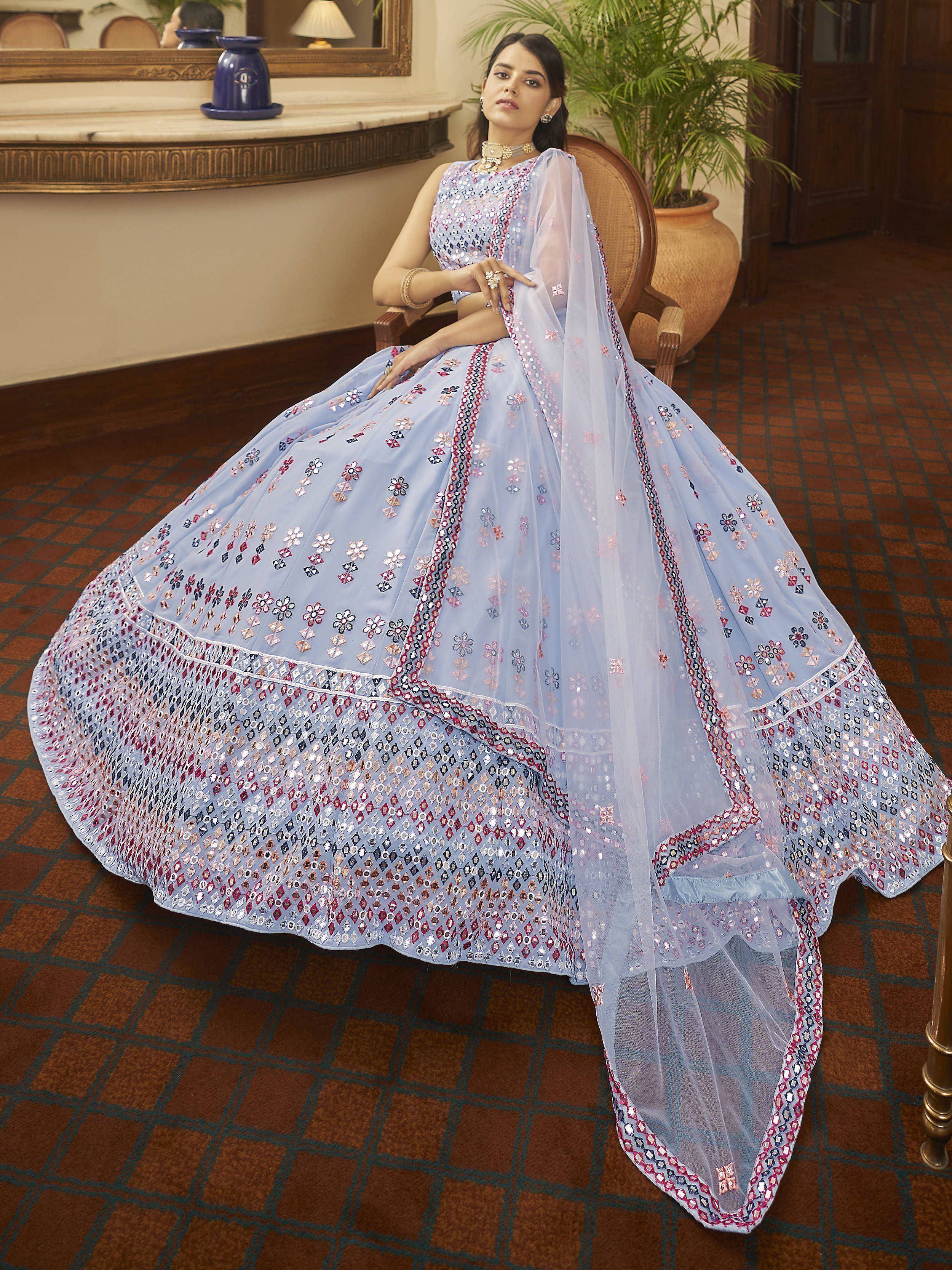 Elegant light blue lehenga choli with floral embroidery and sequin detailing, perfect for Indian ethnic occasions.