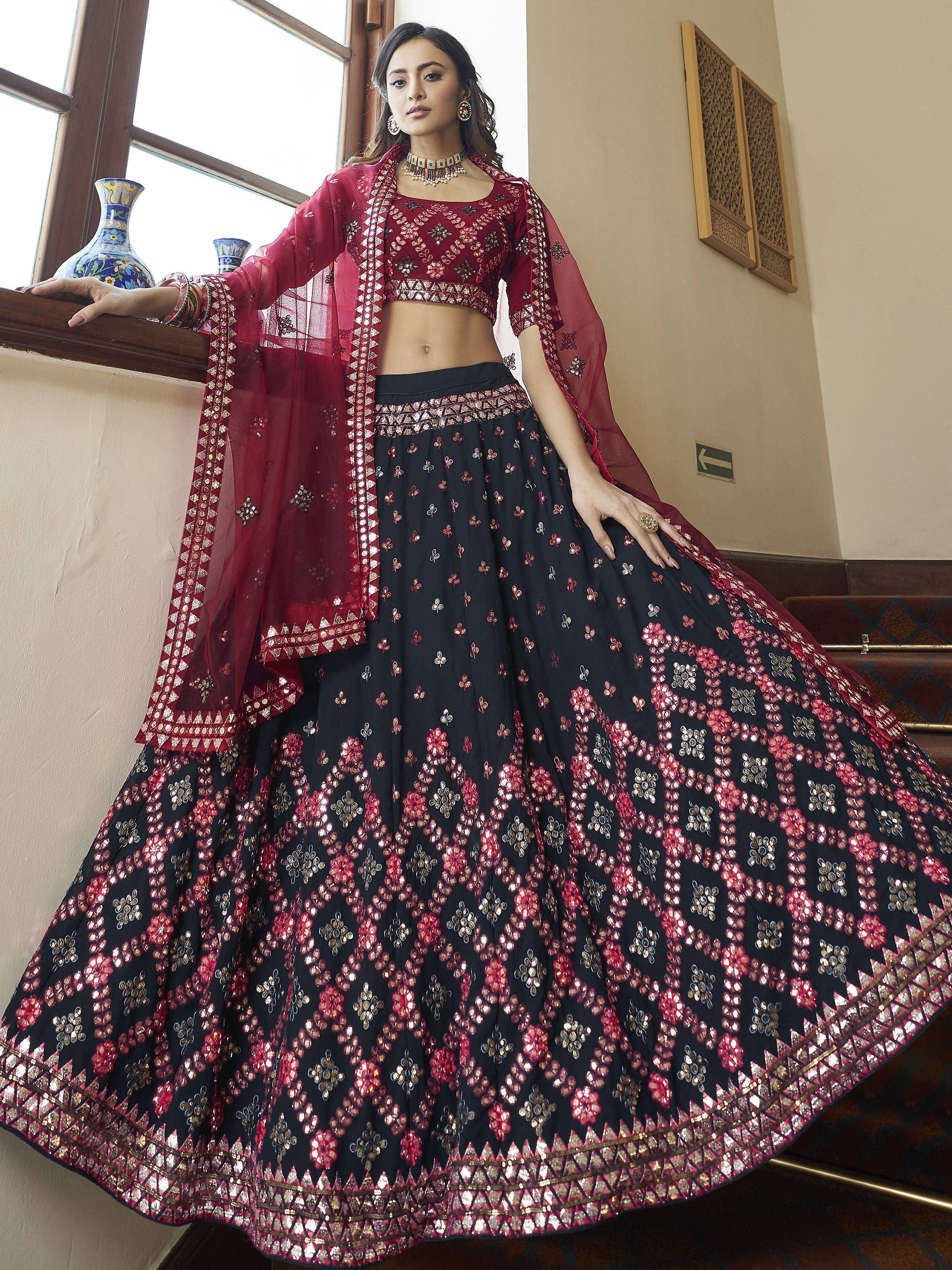 Elegant maroon and black embroidered lehenga choli with floral mirror work, perfect for Indian ethnic occasions.