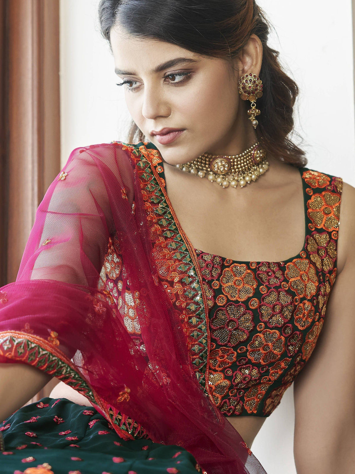 Elegant Indian ethnic wear with floral embroidery, paired with traditional jewelry and a sheer dupatta.
