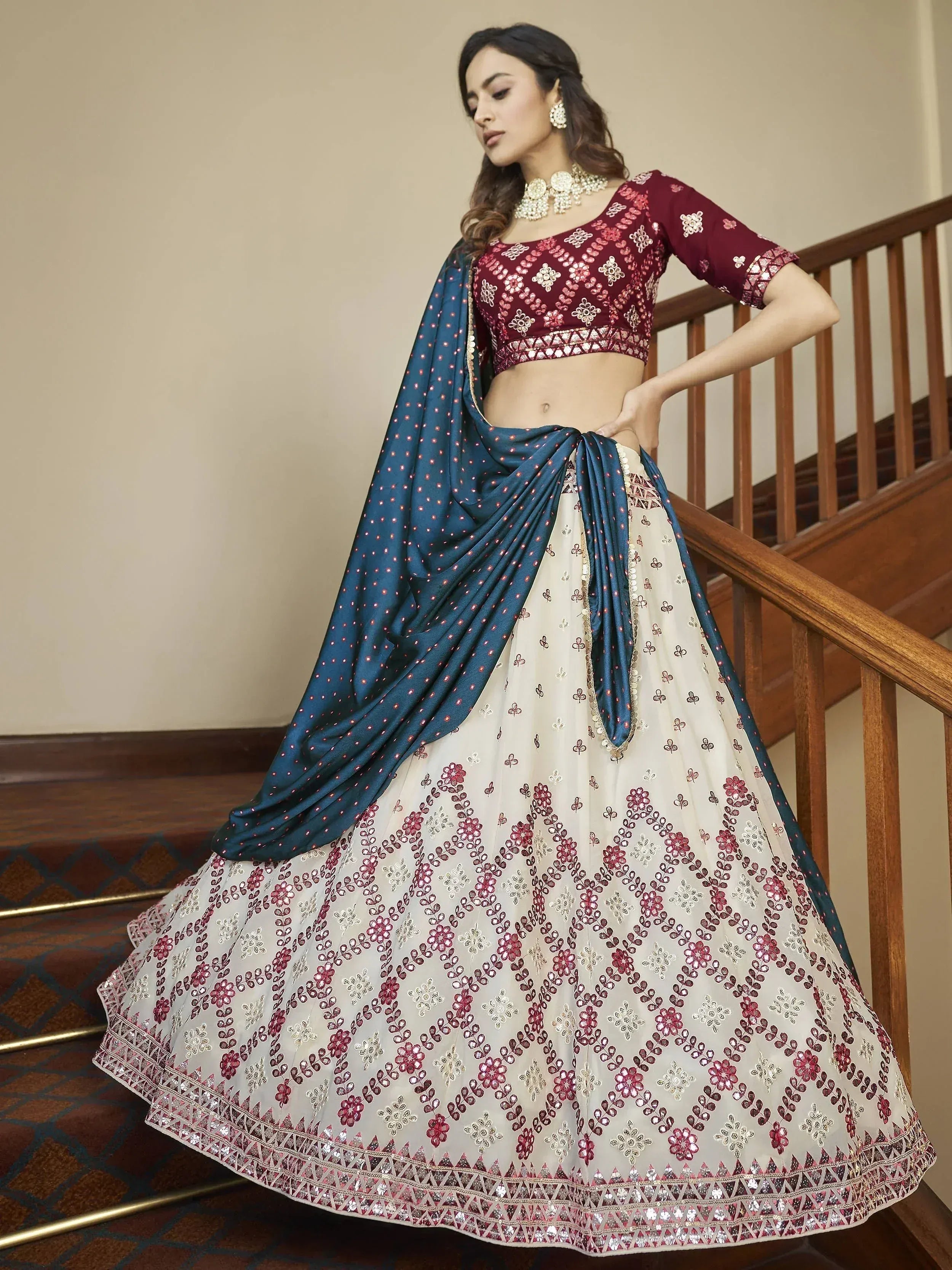 Elegant maroon and cream embroidered lehenga choli with blue dupatta, perfect for Indian ethnic occasions