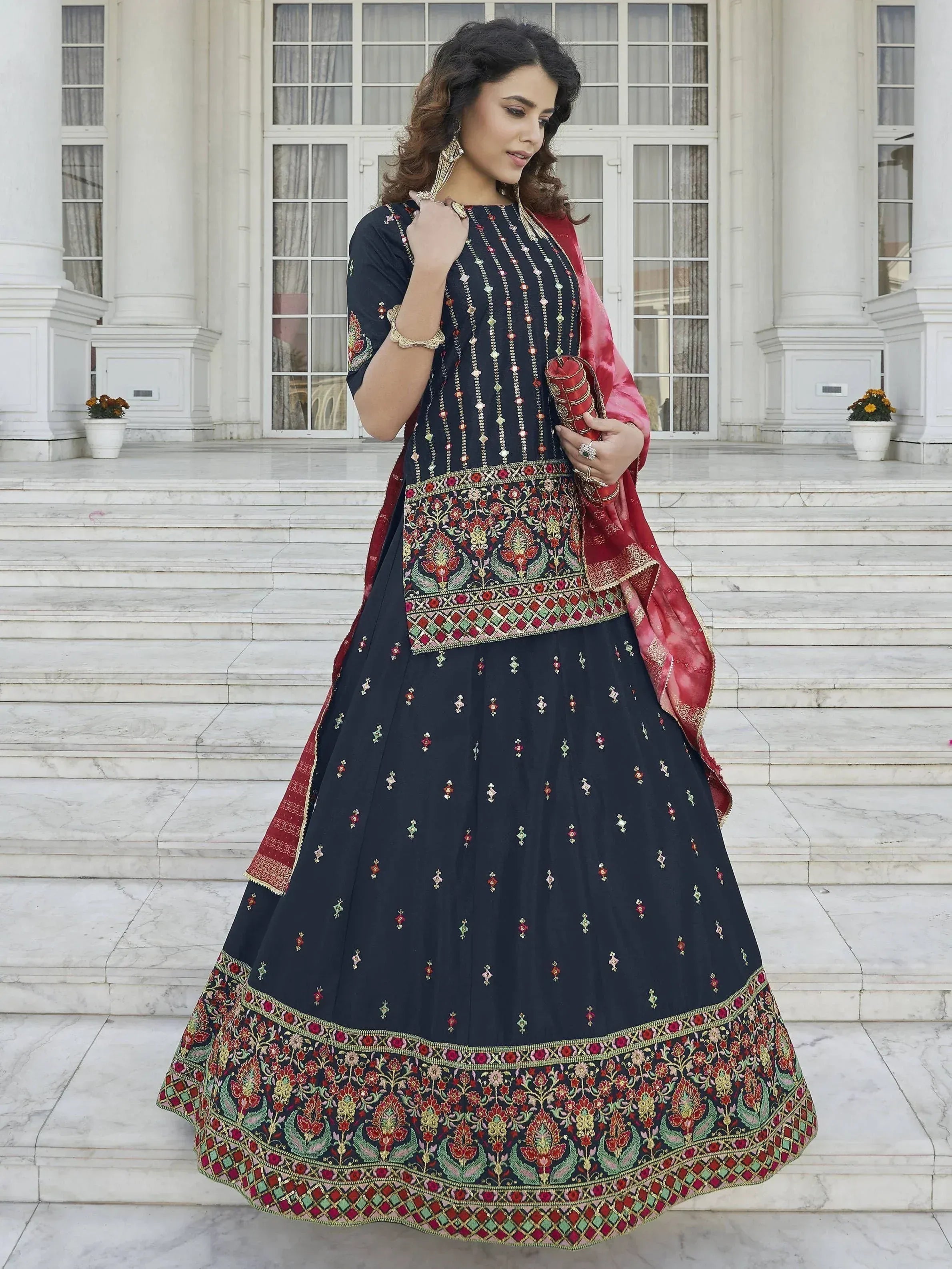 Elegant navy blue embroidered lehenga choli with red dupatta, perfect for Indian ethnic wear occasions.
