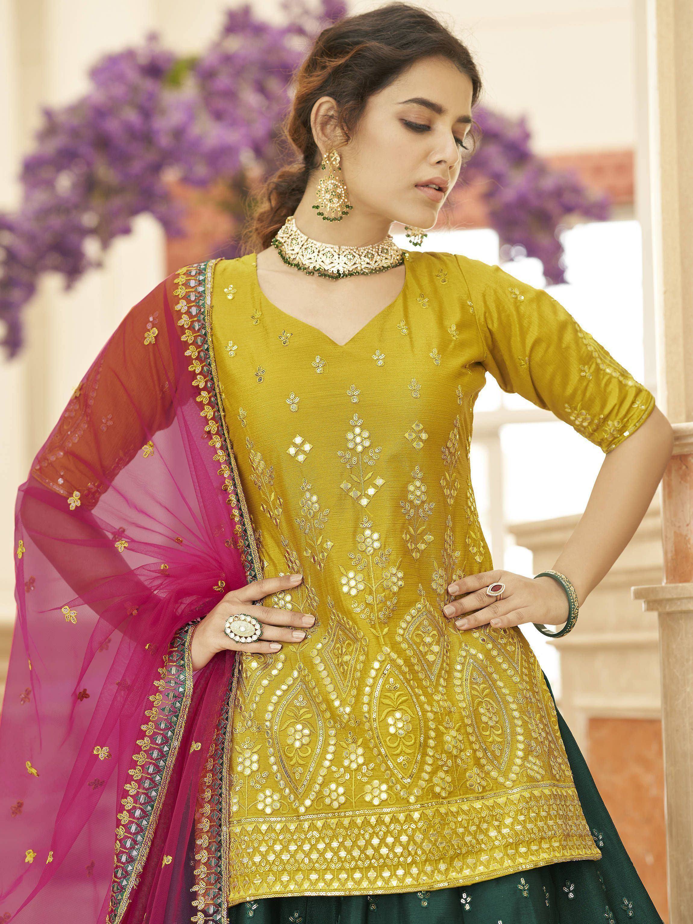 Yellow embroidered ethnic salwar kameez with pink dupatta, perfect for Indian festive occasions