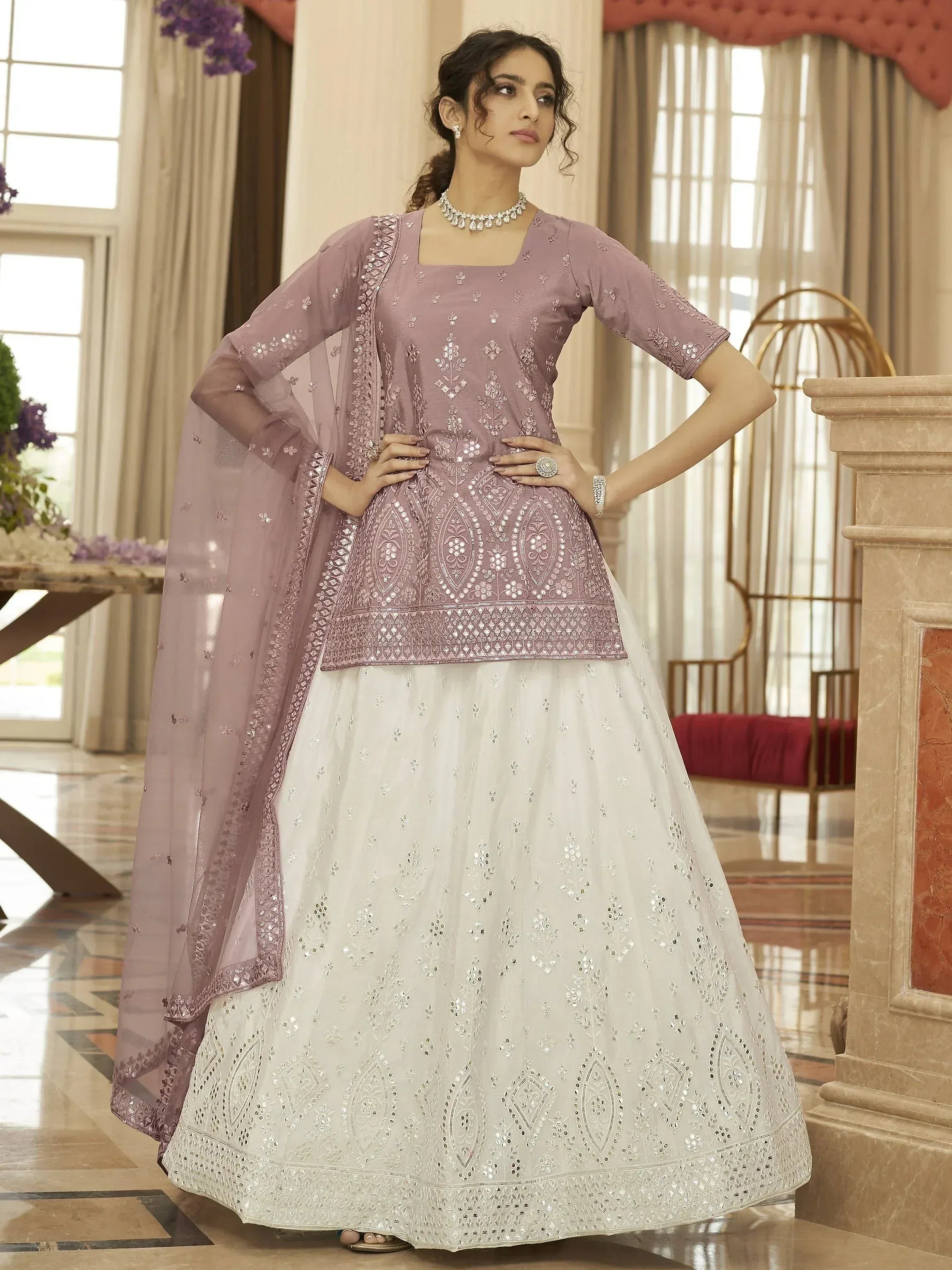 Elegant mauve and white embroidered lehenga choli with matching dupatta, perfect for Indian ethnic occasions.