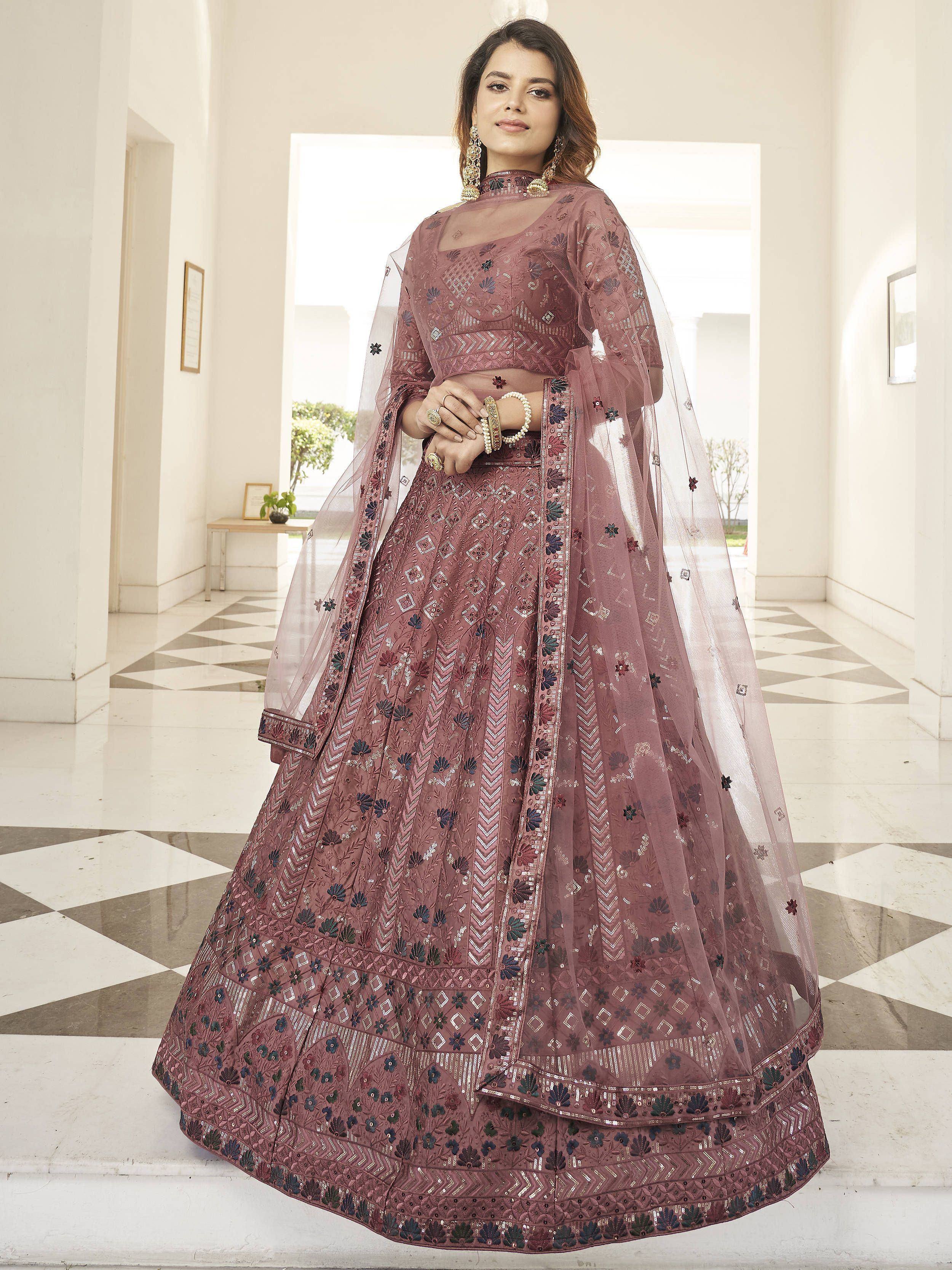 Elegant mauve designer lehenga choli with intricate embroidery and sheer dupatta for Indian ethnic wear