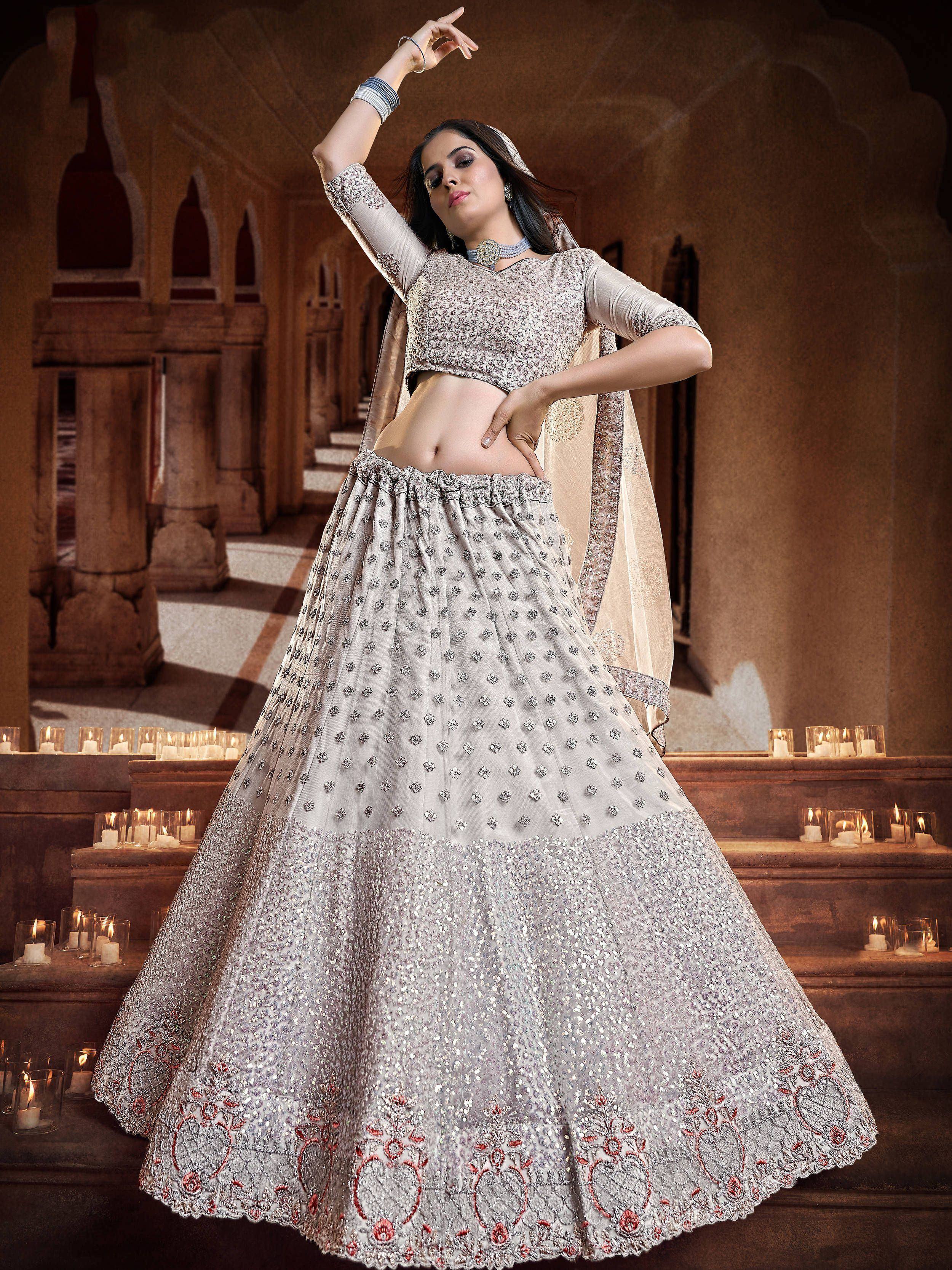 Elegant silver lehenga choli with intricate embroidery, perfect for Indian ethnic wear and festive occasions.