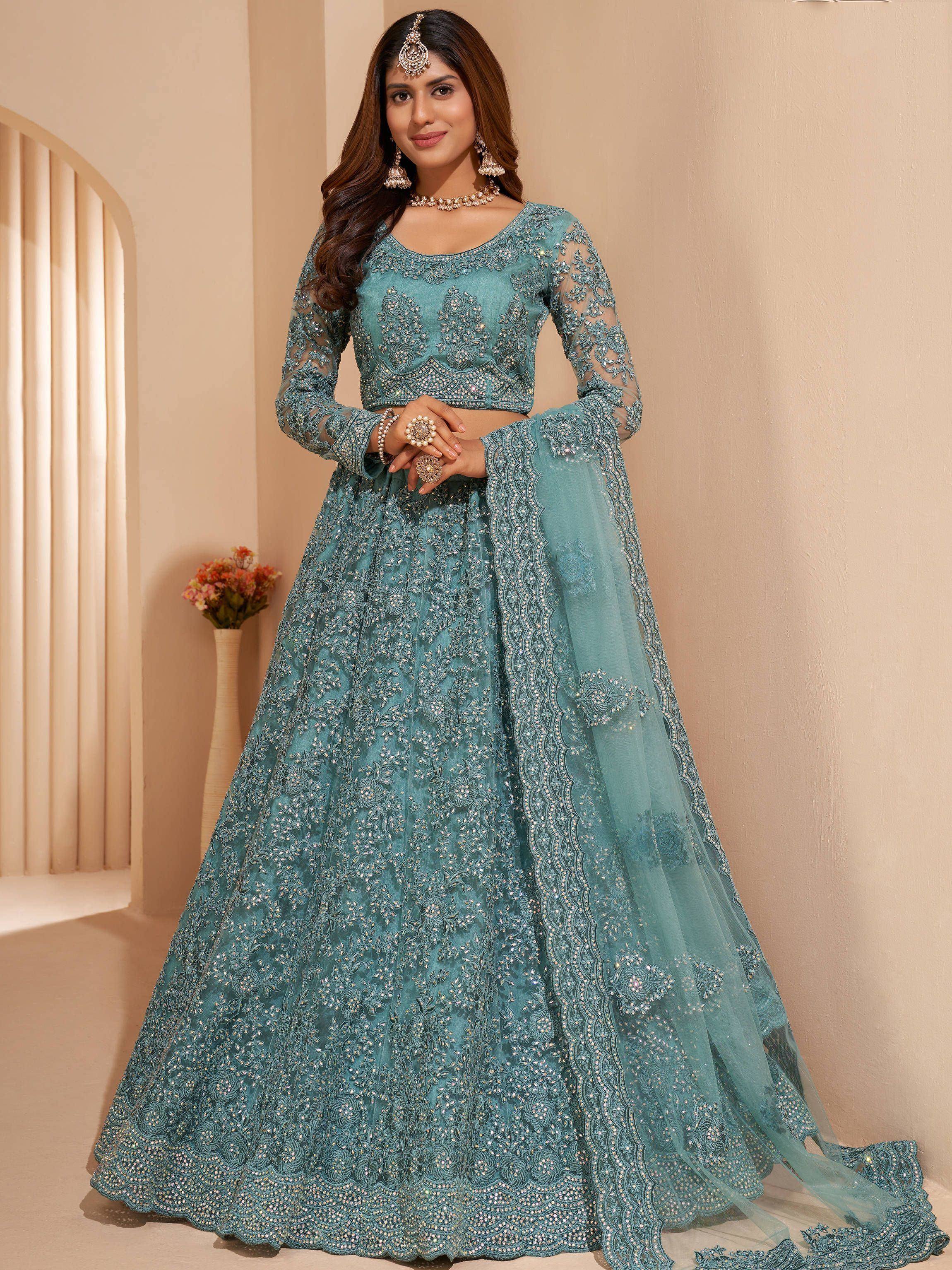 Teal blue embroidered lehenga choli with sheer sleeves and dupatta, perfect for Indian weddings and festive occasions