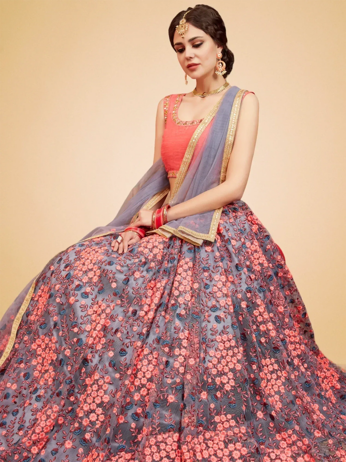 Grey and coral floral embroidered lehenga choli with gold trim, perfect for Indian ethnic wear occasions