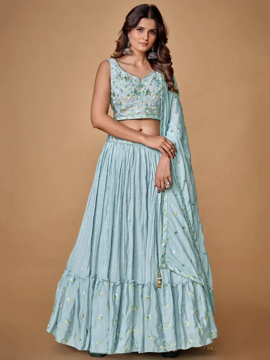 Light blue embroidered lehenga choli with floral motifs and matching dupatta, perfect for Indian ethnic occasions.