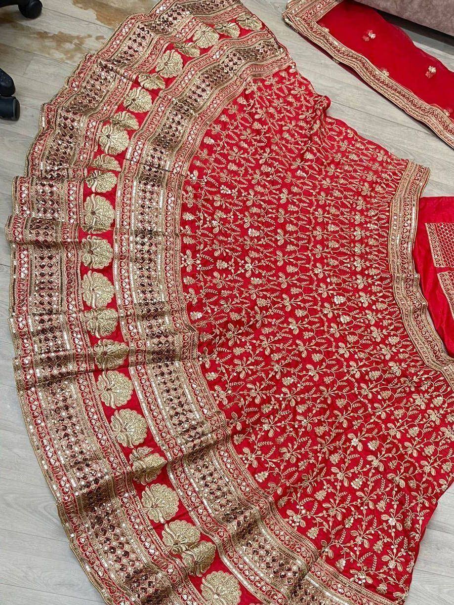Red designer lehenga choli with gold floral embroidery and embellished border, ethnic Indian wear