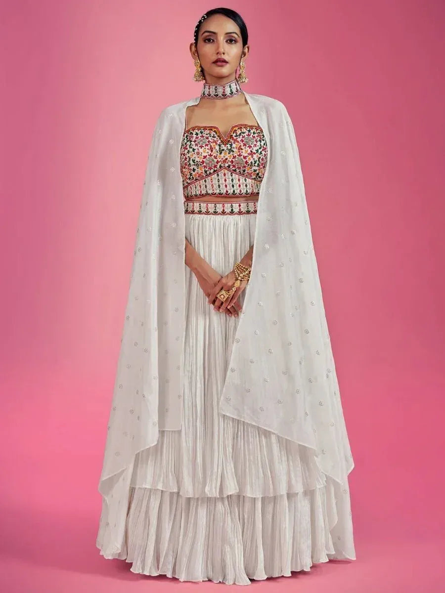White embroidered lehenga choli with floral blouse and sheer cape, perfect for Indian ethnic occasions
