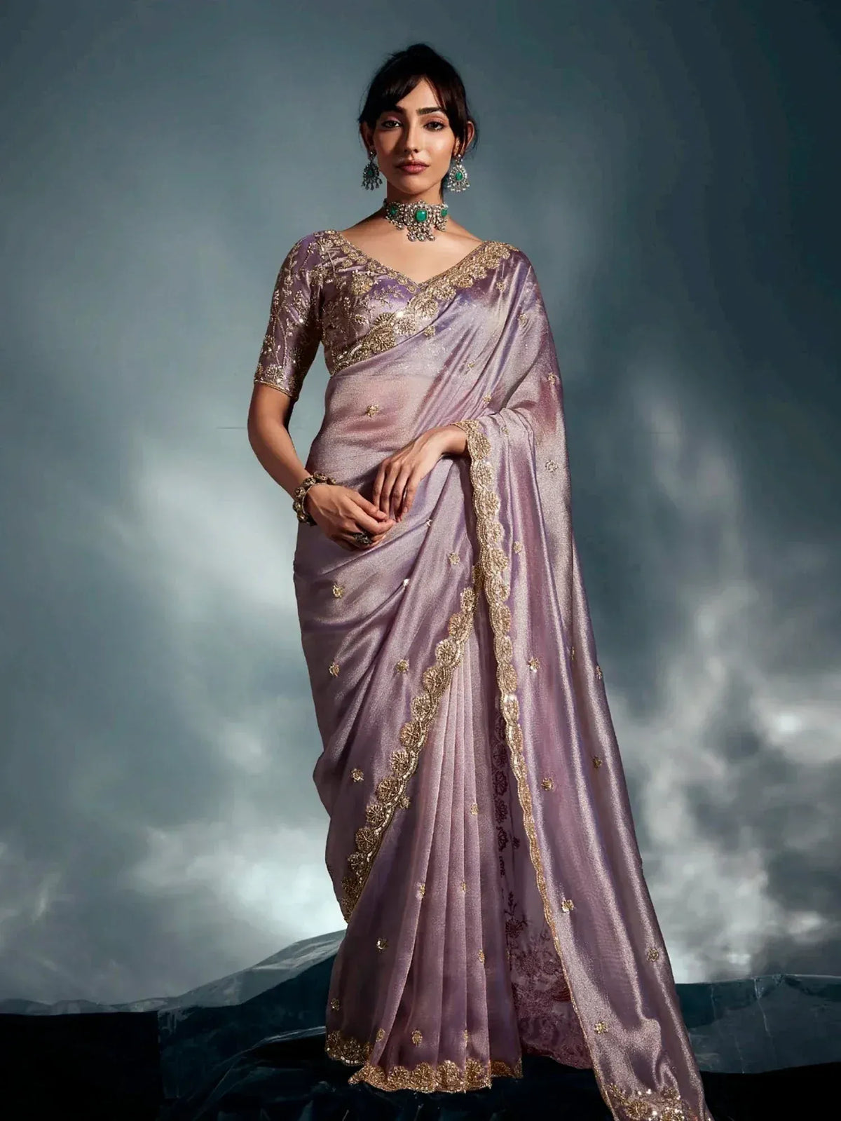 Elegant lavender saree with gold embroidery, perfect for Indian ethnic wear and festive occasions.