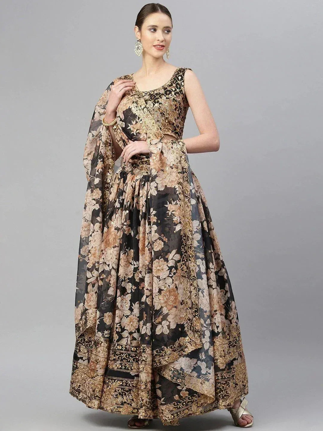Black and gold floral lehenga choli with embroidered border, perfect for Indian ethnic occasions