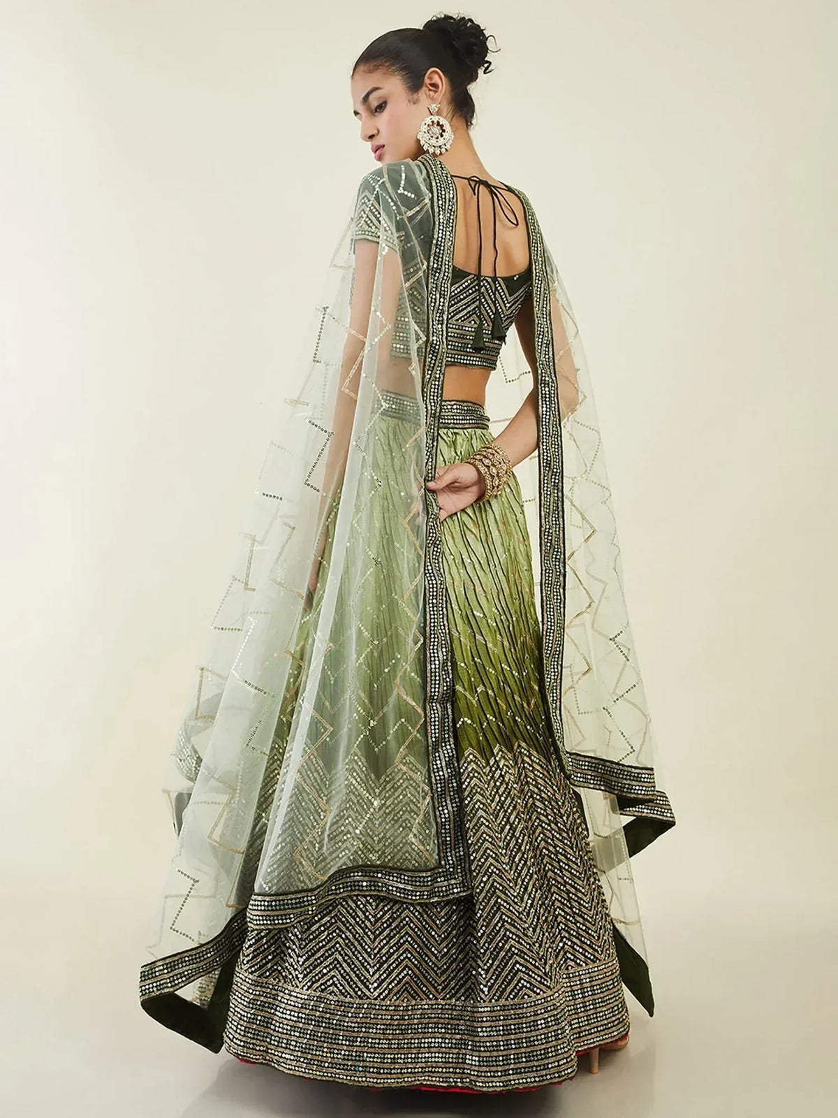 Green embroidered lehenga choli with sheer dupatta, perfect for Indian ethnic wear