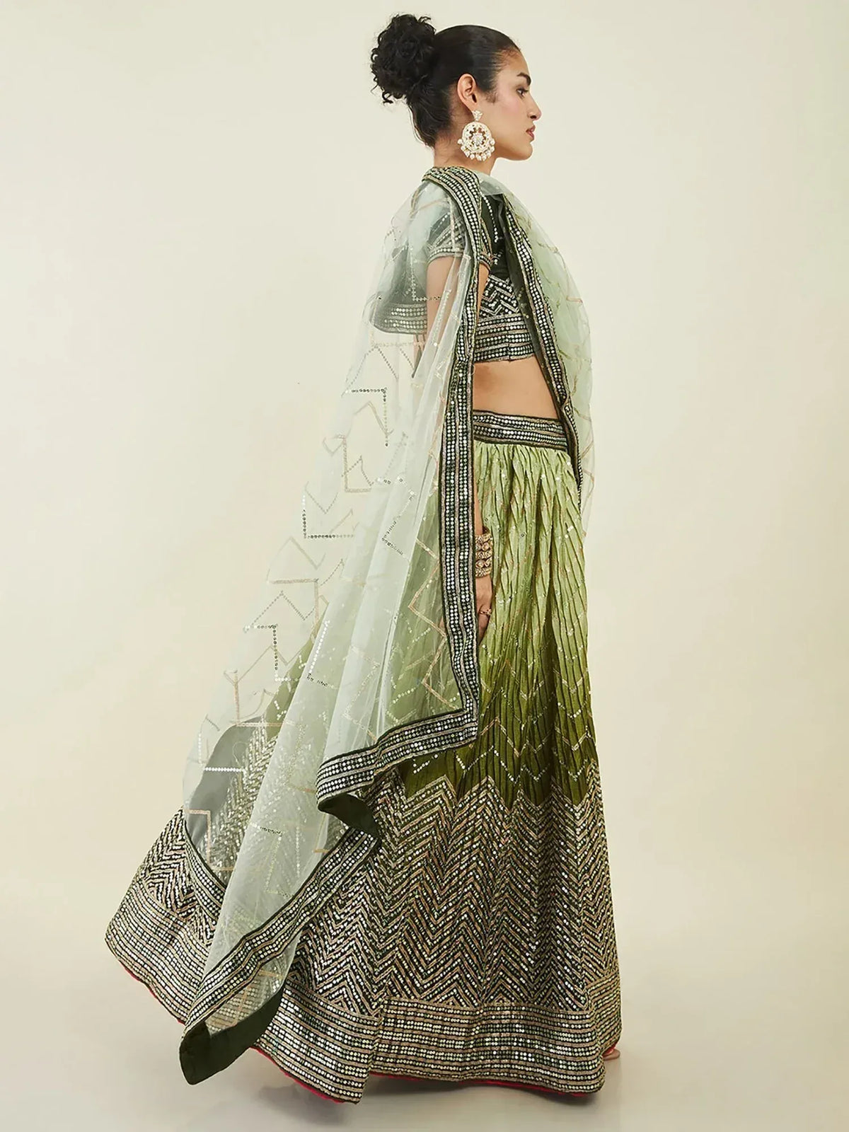 Green embroidered lehenga choli with sheer dupatta, perfect for Indian ethnic wear