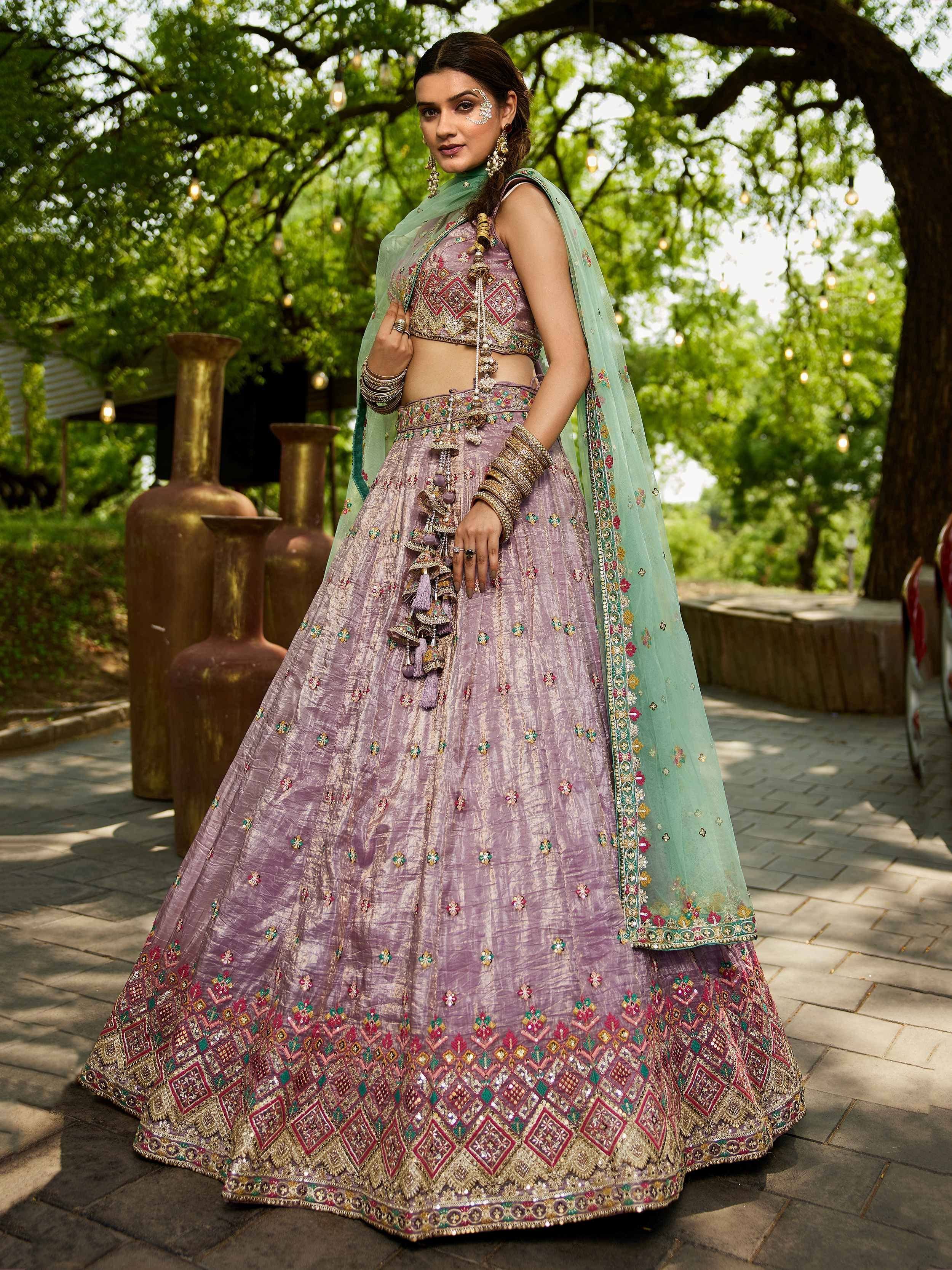 Lavender embroidered lehenga choli with mint dupatta, perfect for Indian weddings and festive occasions.