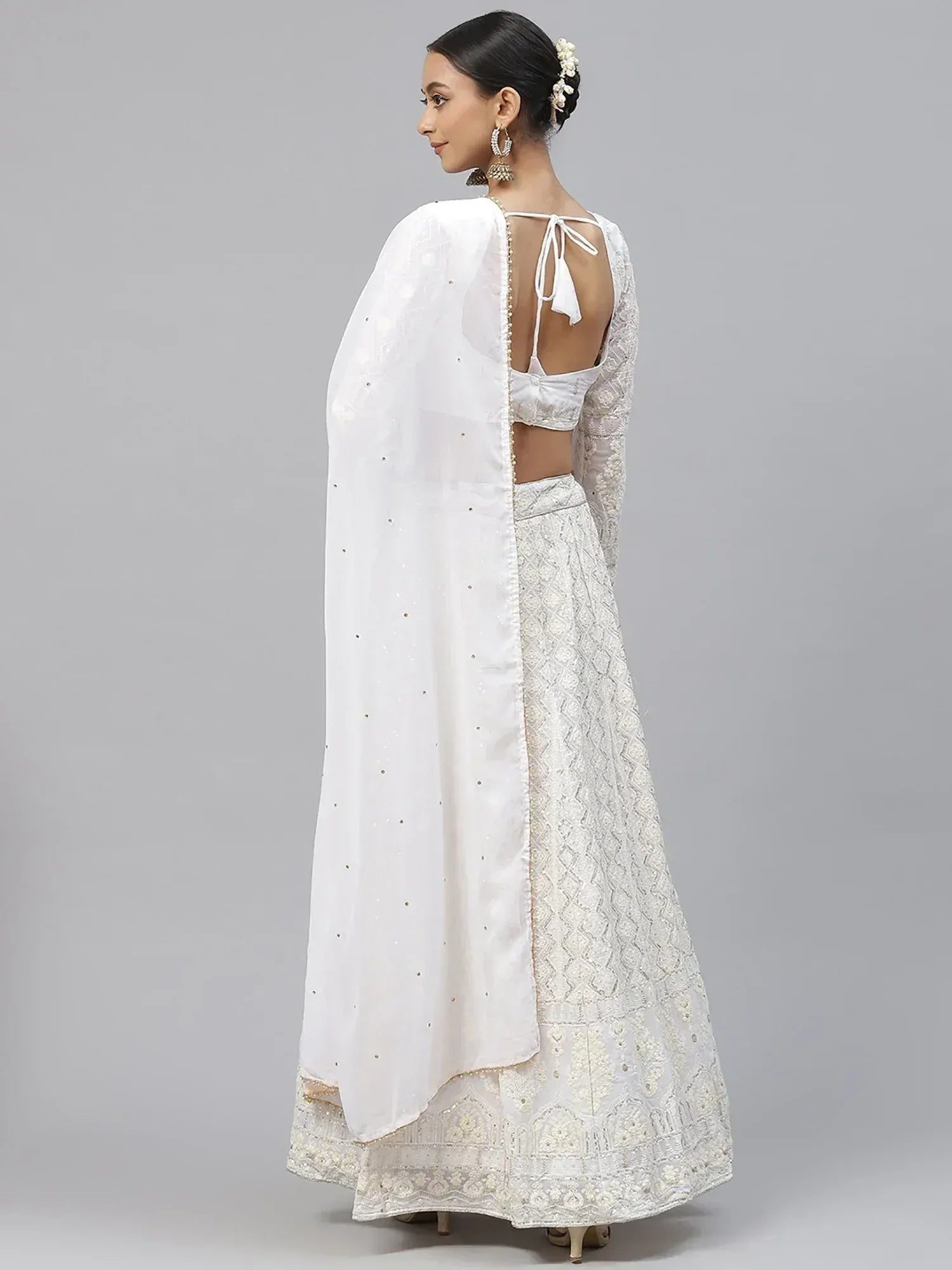 White embroidered lehenga choli with sheer dupatta, back view, ethnic Indian wear