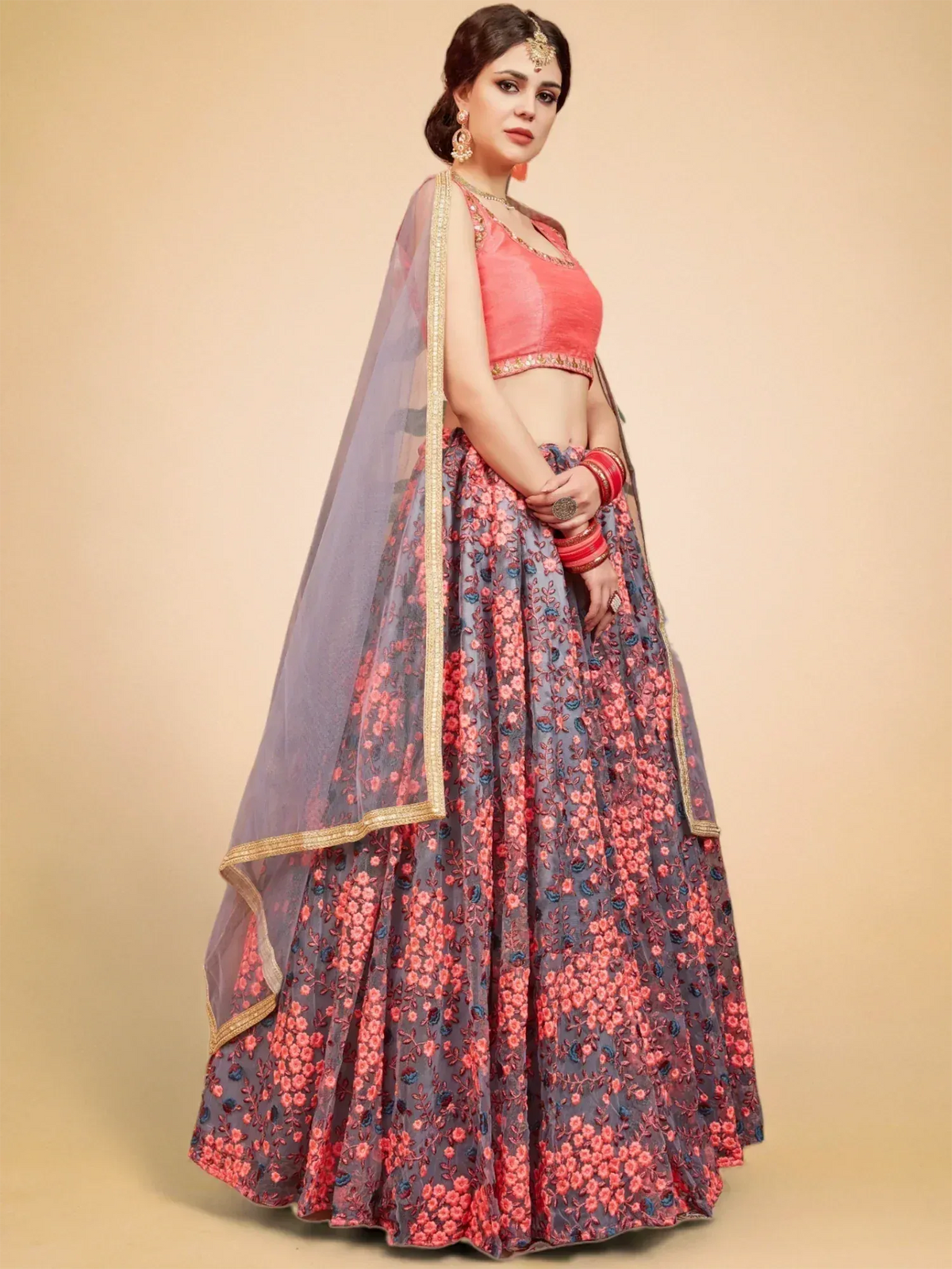 Pink and grey floral lehenga choli with gold trim, perfect for Indian weddings and festive occasions.