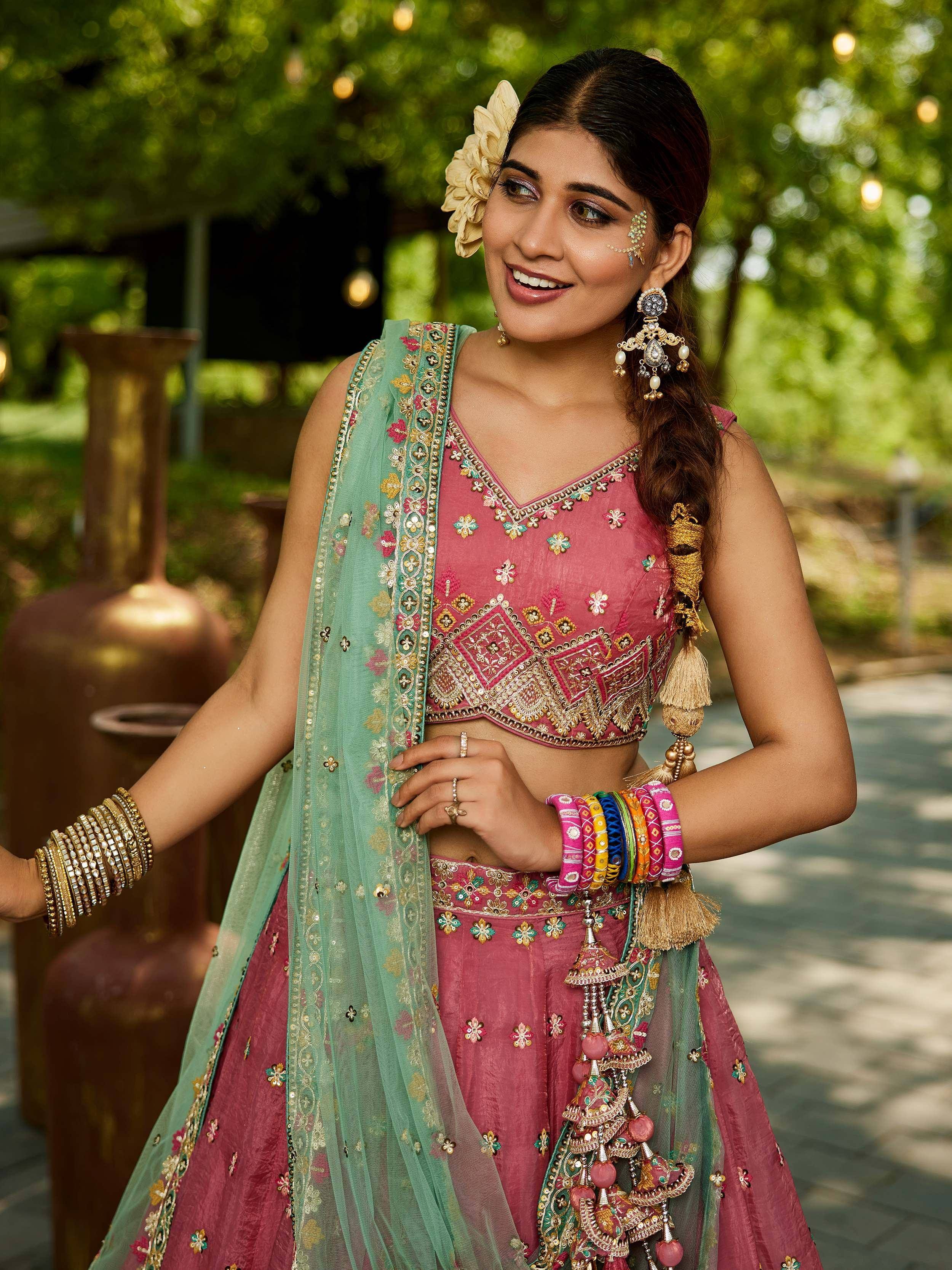 Pink embroidered lehenga choli with green dupatta, traditional Indian ethnic wear for women