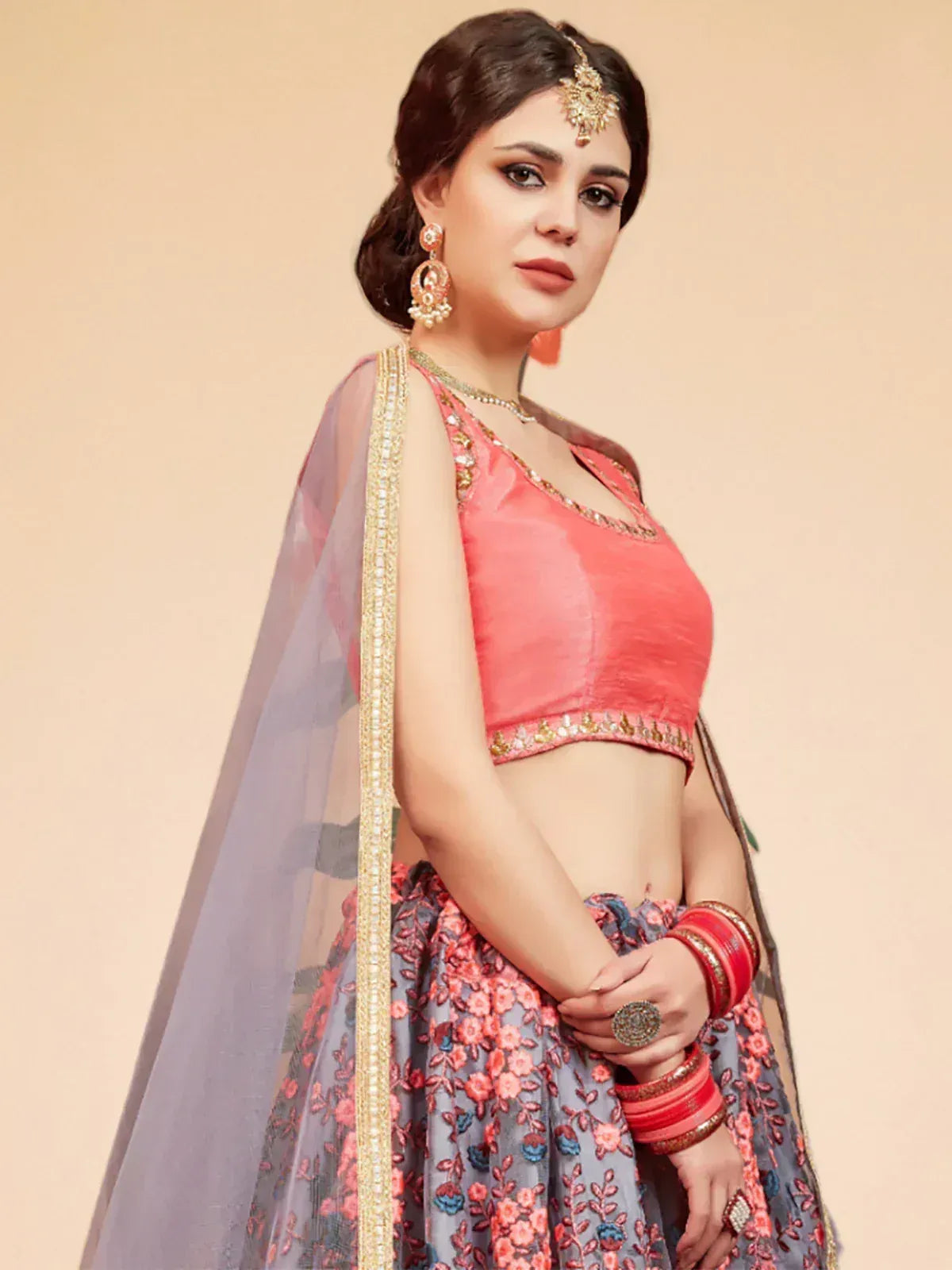 Pink and grey floral lehenga choli with gold embroidery, perfect for Indian weddings and festive occasions