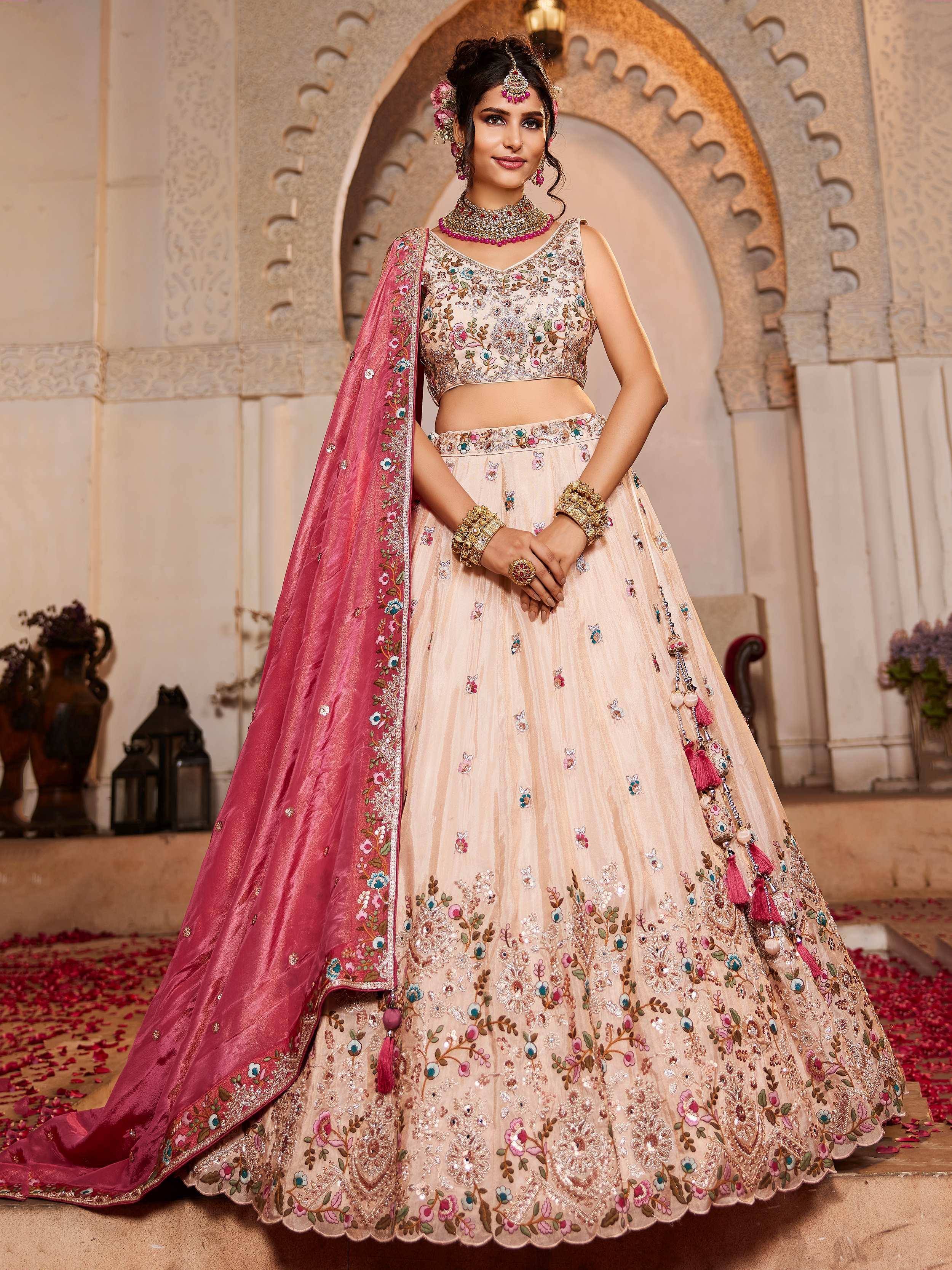 Elegant beige lehenga choli with floral embroidery, pink dupatta, perfect for Indian weddings and festive occasions.