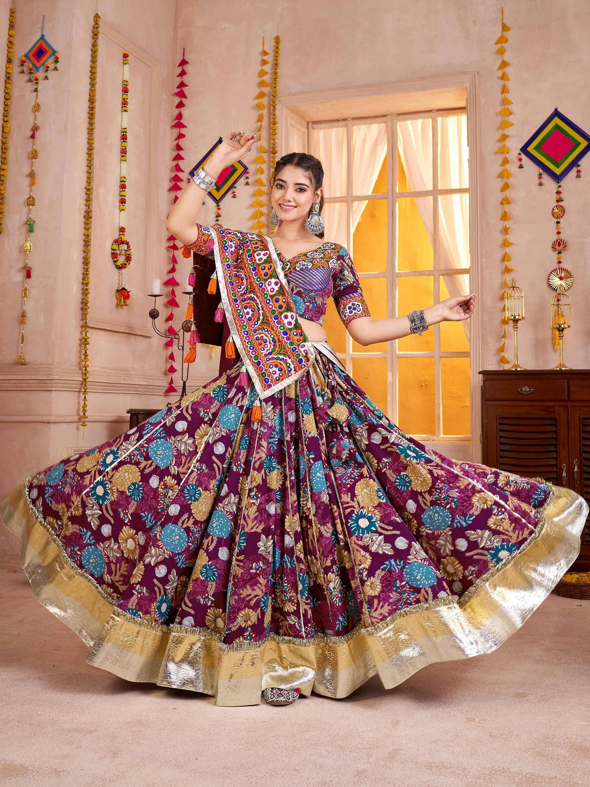 Vibrant purple floral lehenga choli with gold border, perfect for Indian ethnic wear and festive occasions.