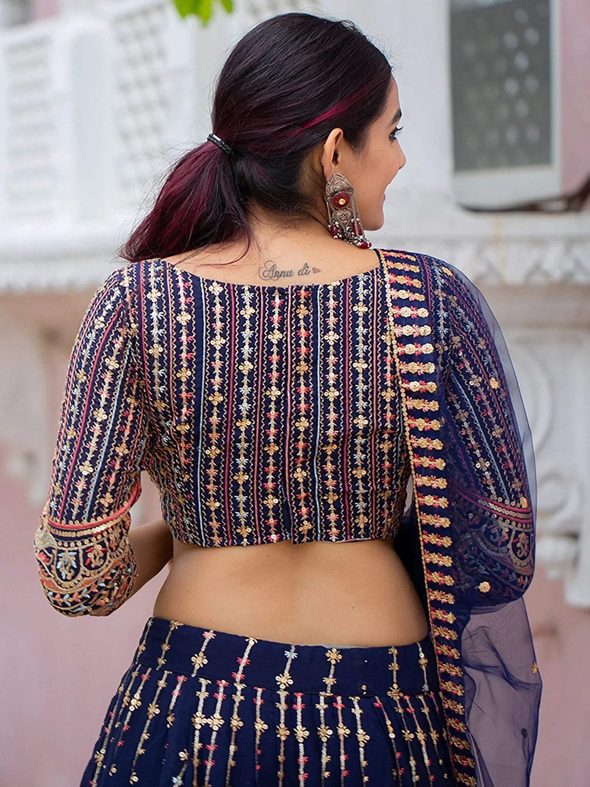 Navy blue embroidered lehenga choli with sheer sleeves, perfect for Indian ethnic wear occasions
