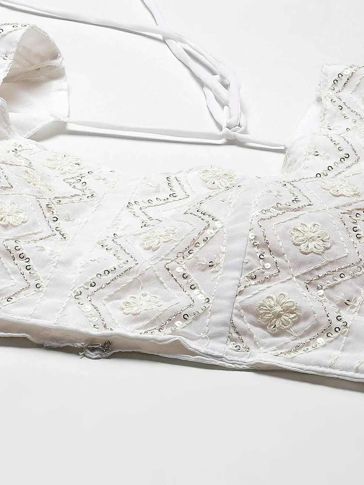 White embroidered blouse with floral and geometric sequin detailing, ideal for ethnic wear