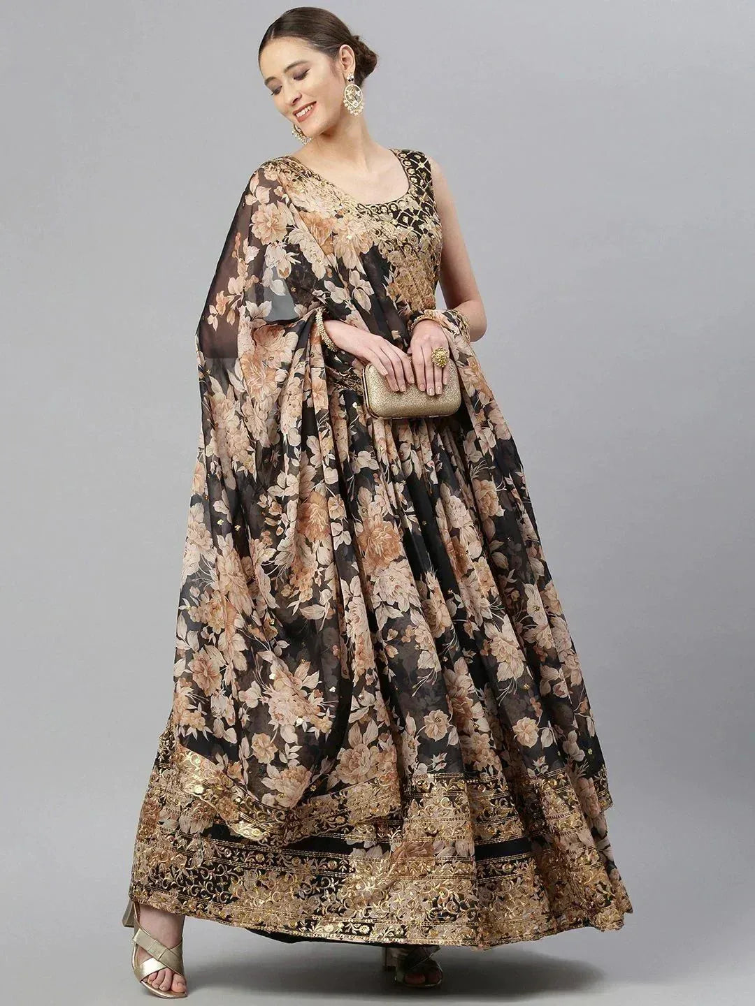 Black and gold floral printed lehenga choli with embroidered border, perfect for Indian ethnic wear occasions