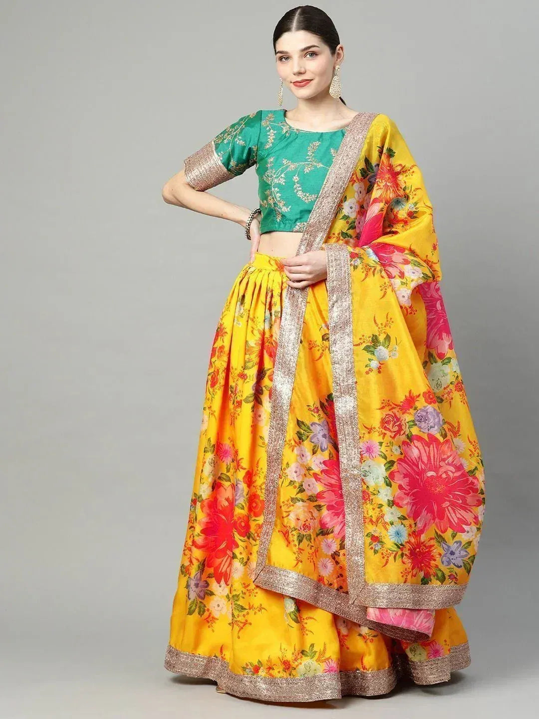 Yellow floral lehenga choli with green embroidered blouse, perfect for Indian ethnic wear occasions