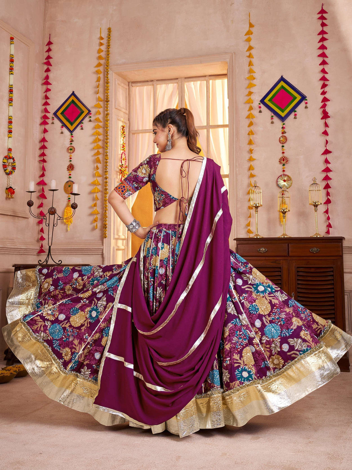 Purple floral lehenga choli with gold border, perfect for Indian ethnic wear occasions
