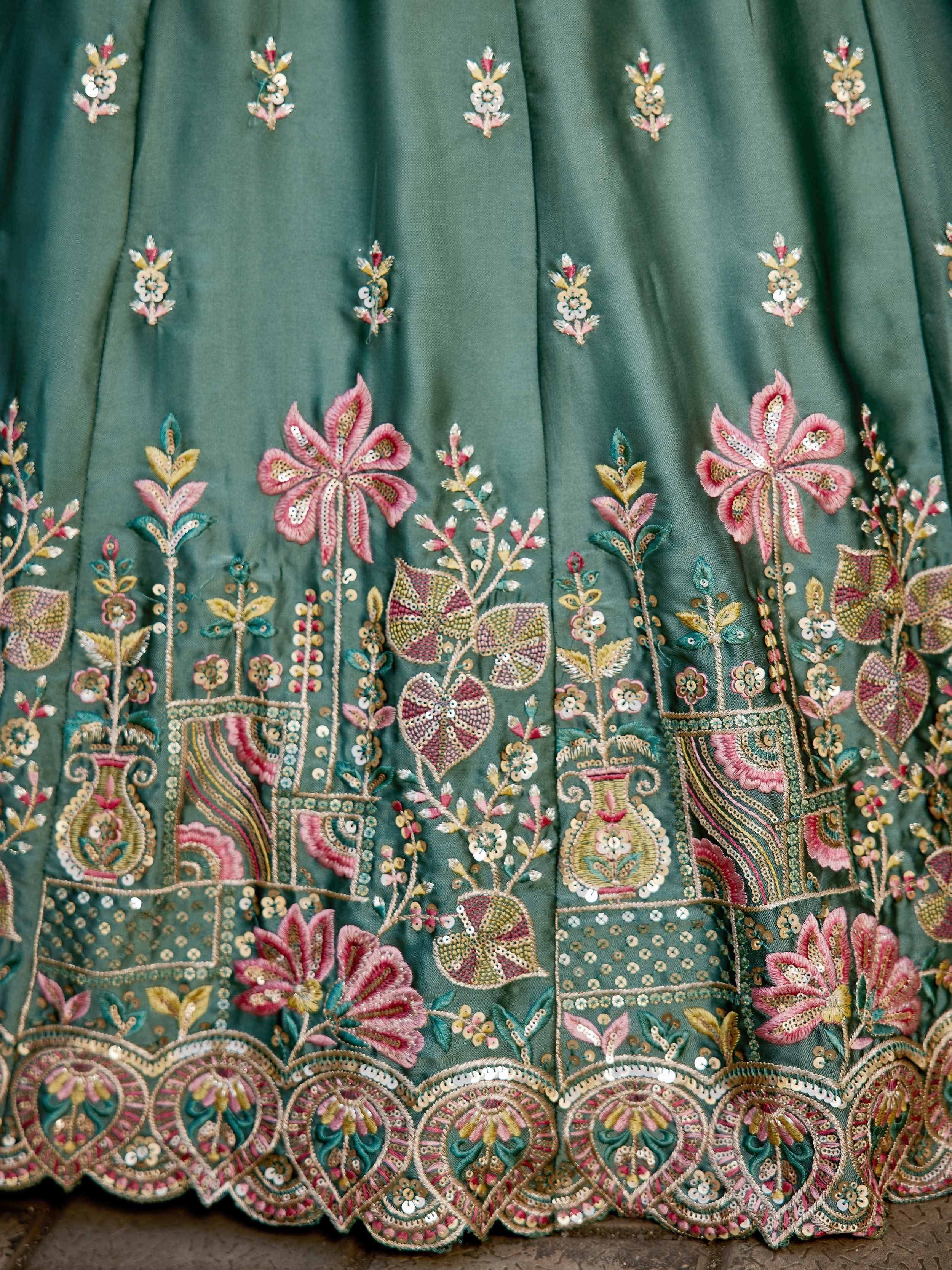 Green lehenga skirt with pink floral embroidery and sequin detailing, ethnic Indian wear