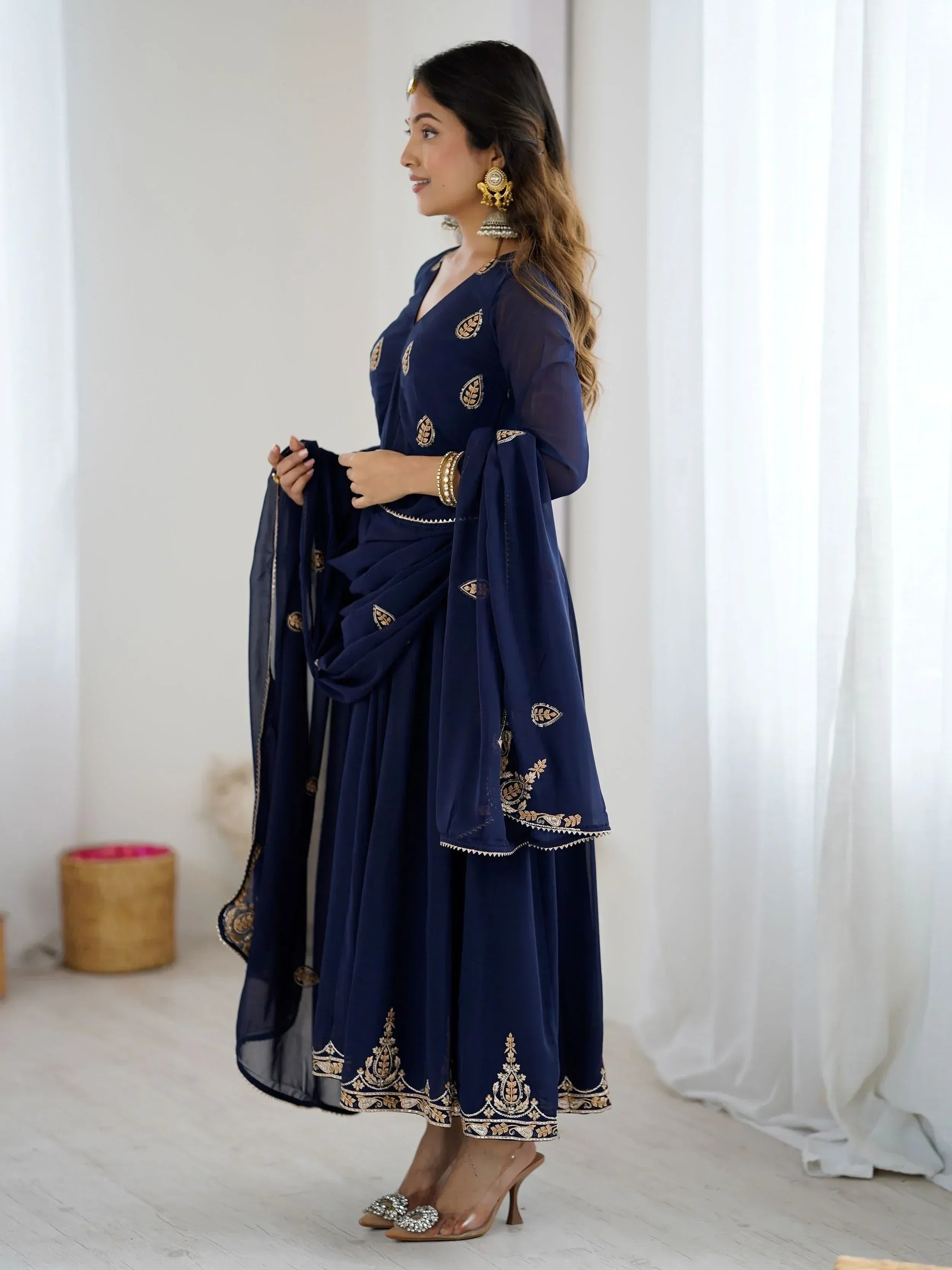 Navy blue embroidered salwar kameez with gold detailing, perfect for Indian ethnic wear occasions