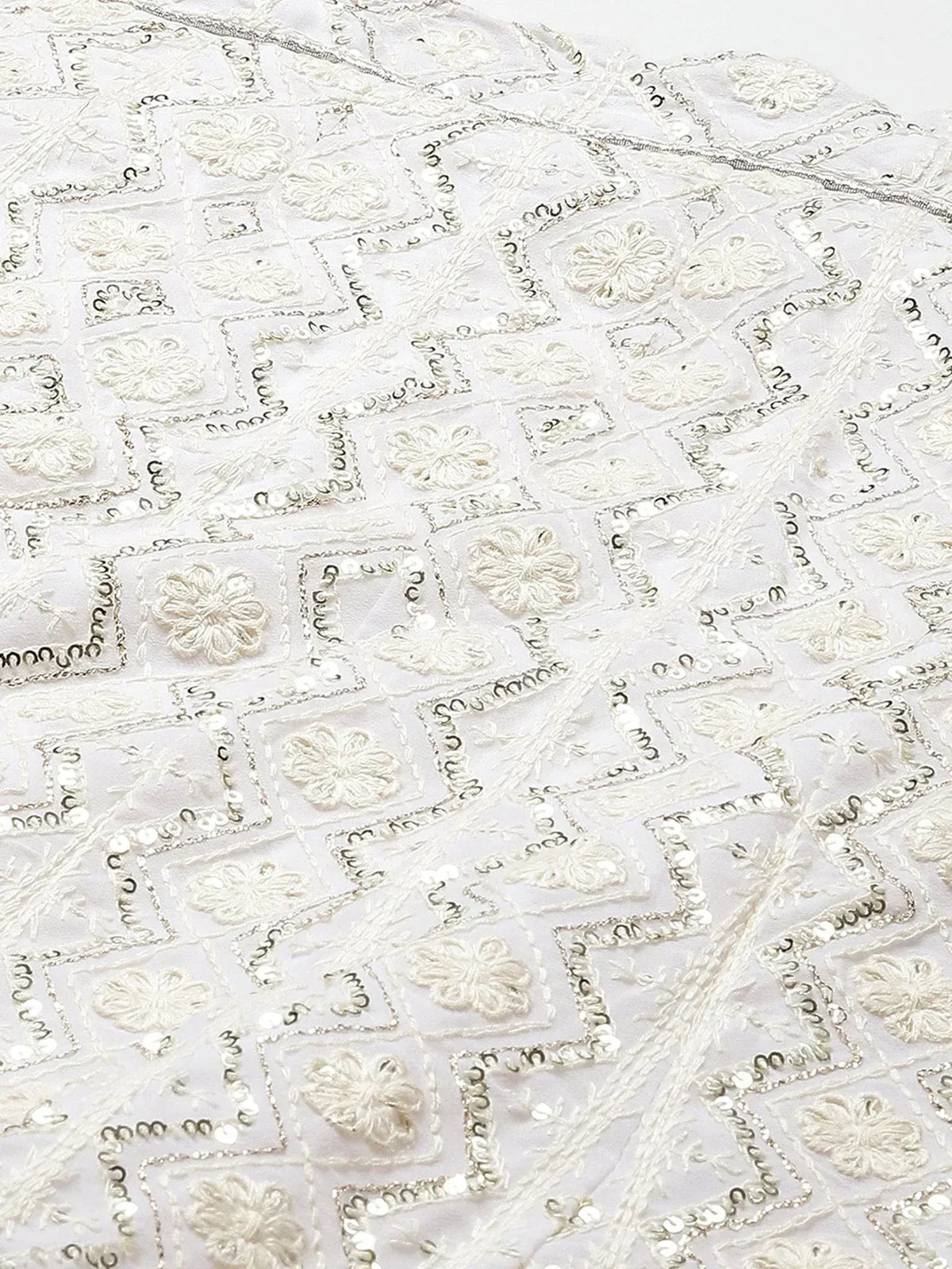 White ethnic wear with floral embroidery and sequin detailing, perfect for Indian designer lehenga or saree
