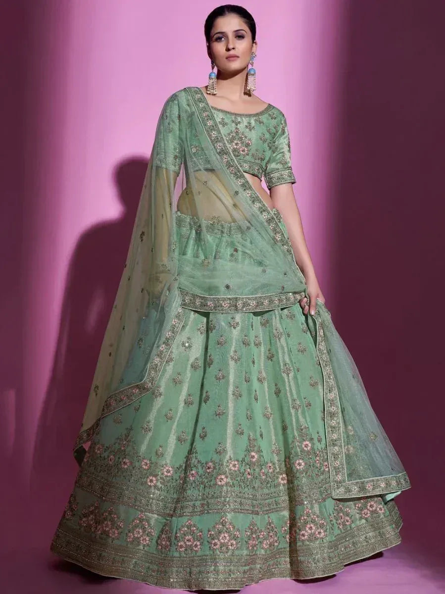 Mint green designer lehenga choli with floral embroidery and sheer dupatta, perfect for Indian ethnic occasions