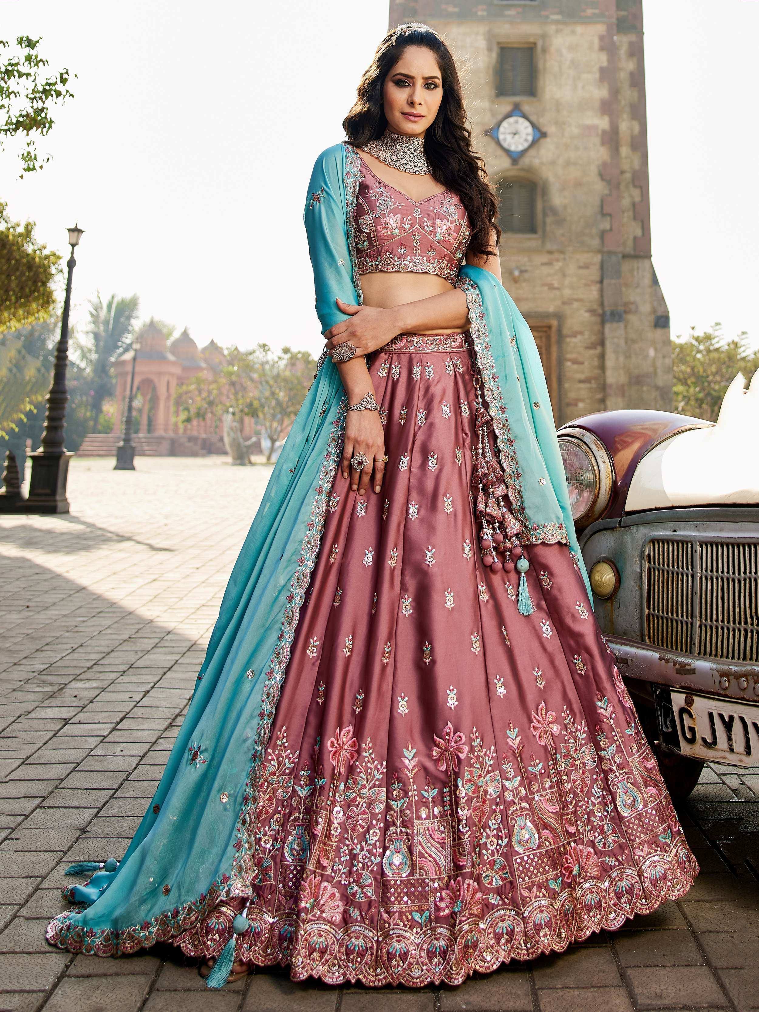 Elegant maroon lehenga choli with turquoise dupatta, intricate floral embroidery, perfect for Indian weddings and festive occasions.