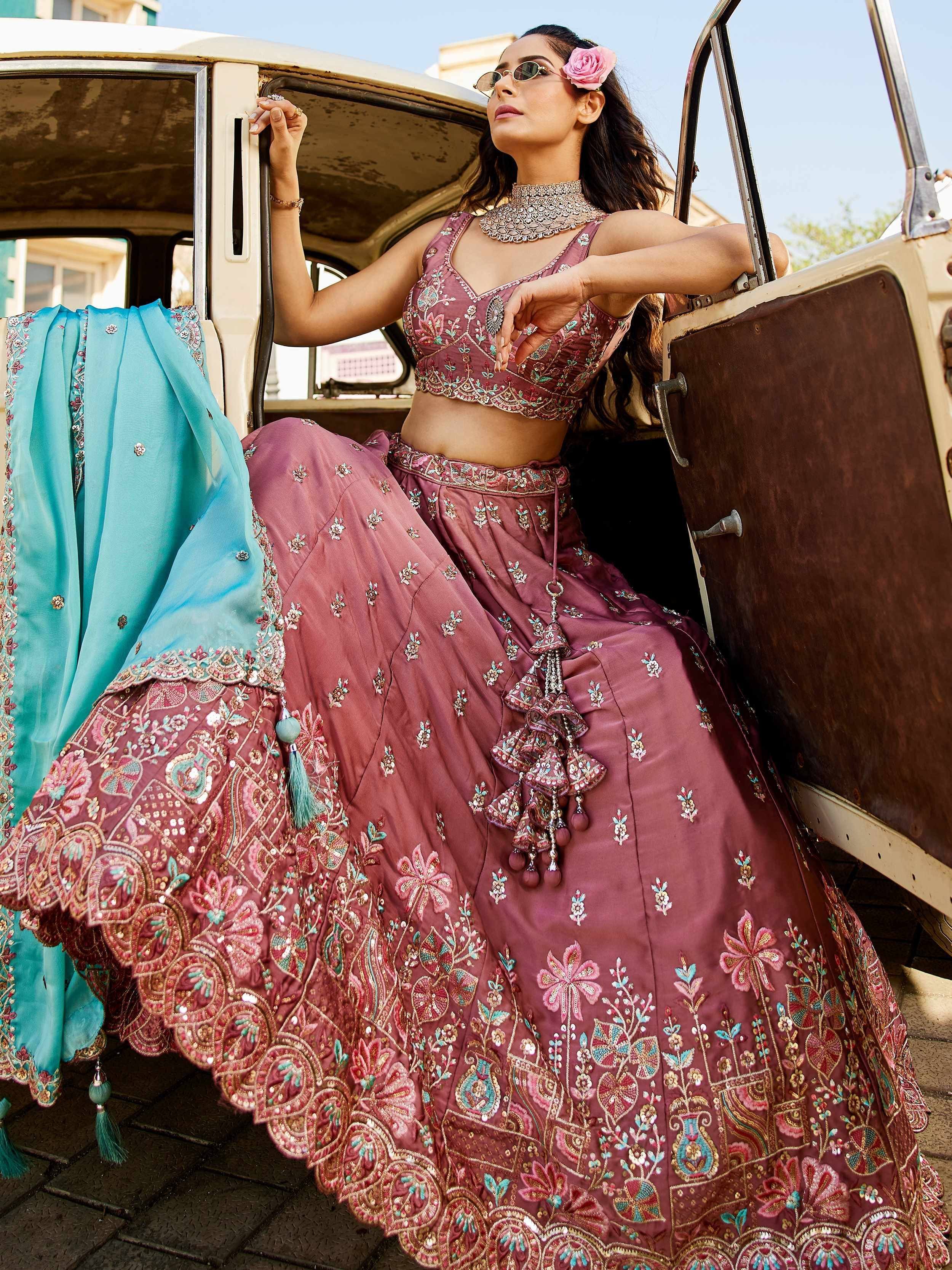 Elegant mauve embroidered lehenga choli with turquoise dupatta, perfect for Indian ethnic wear events.