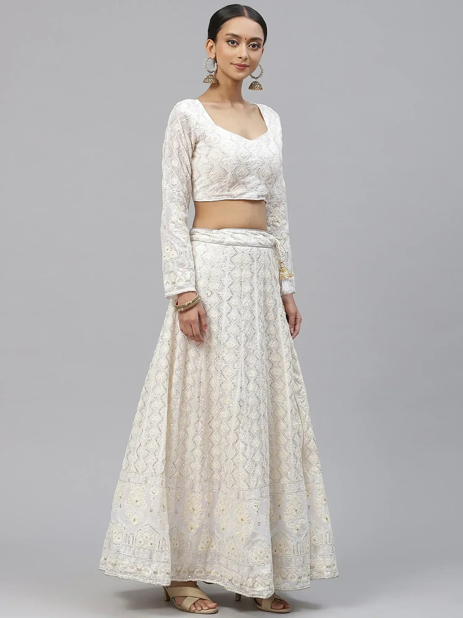White embroidered lehenga choli with long sleeves, perfect for Indian ethnic wear and festive occasions.