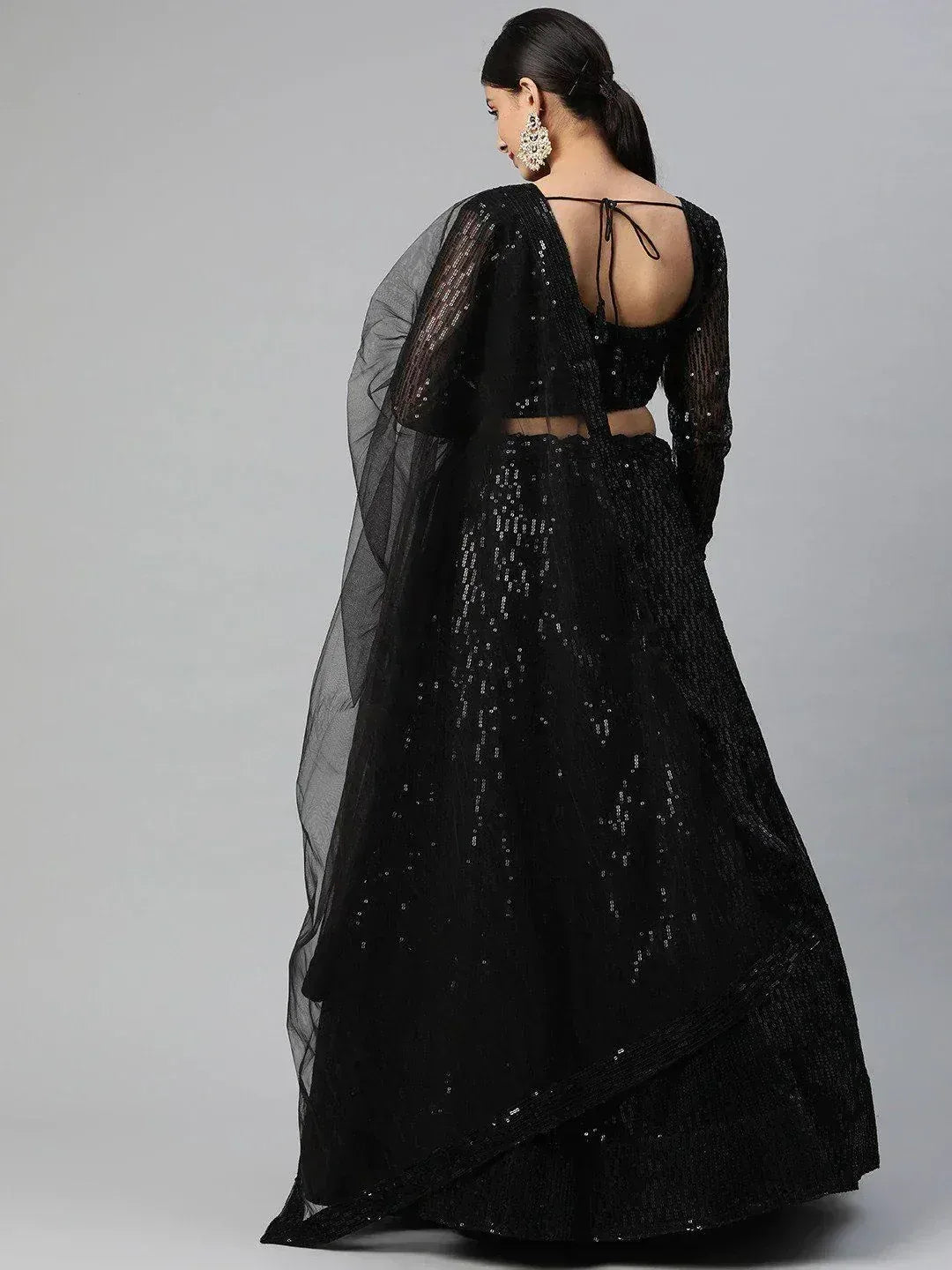 Black sequin lehenga choli with sheer cape, back view, ethnic Indian wear