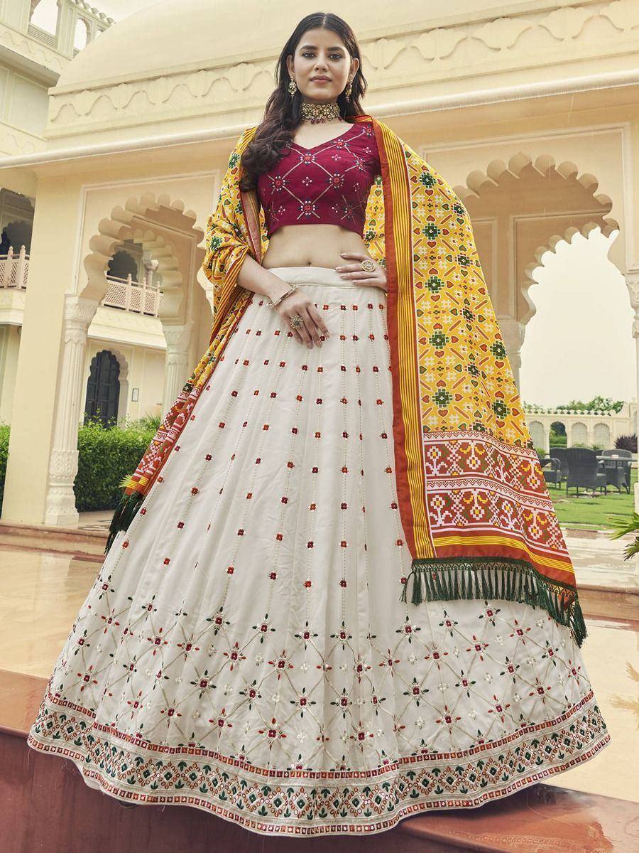 Elegant white lehenga choli with maroon blouse and yellow dupatta, perfect for Indian ethnic occasions