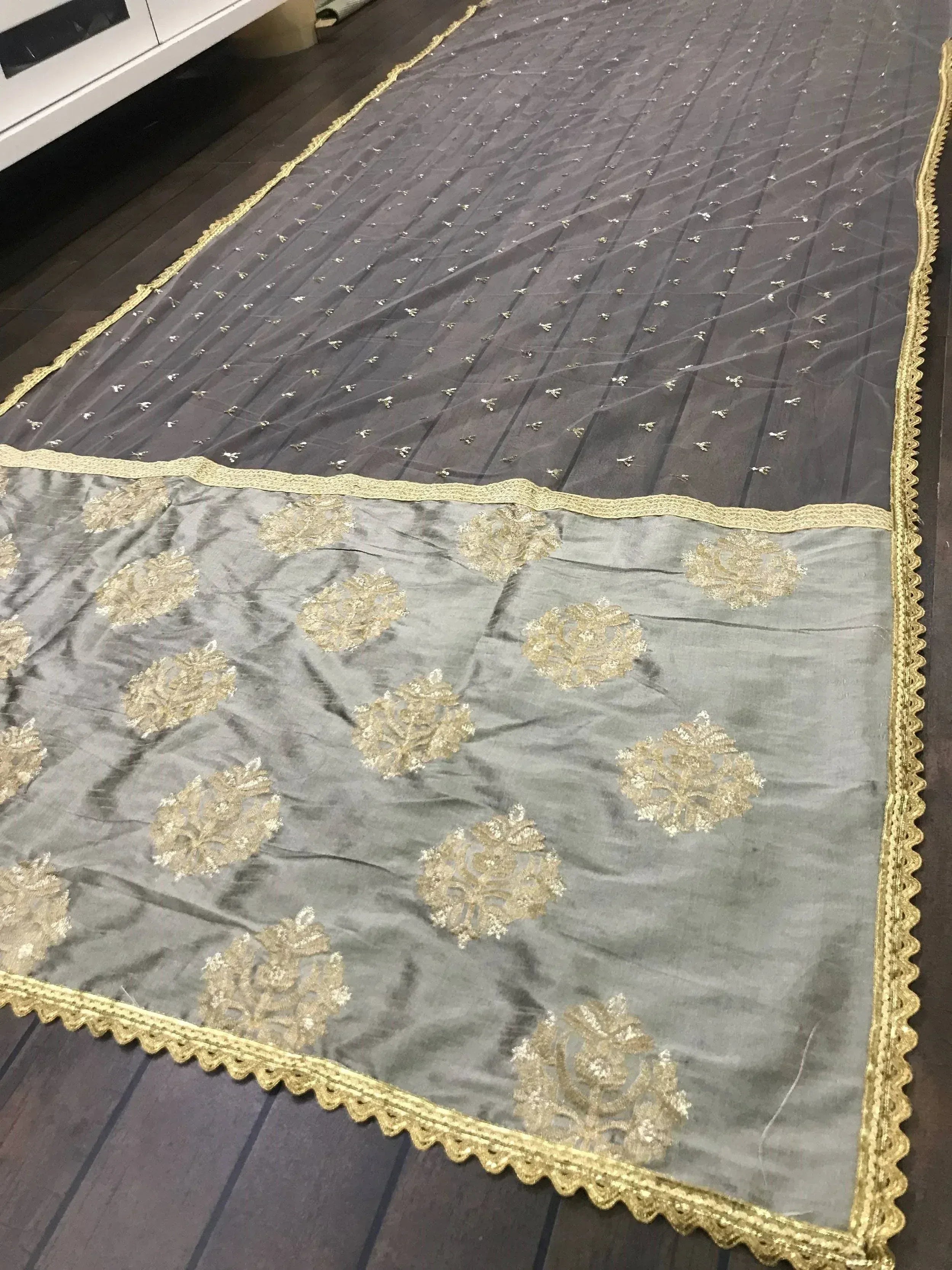 Grey ethnic saree with gold floral embroidery and sequin border, perfect for Indian occasions