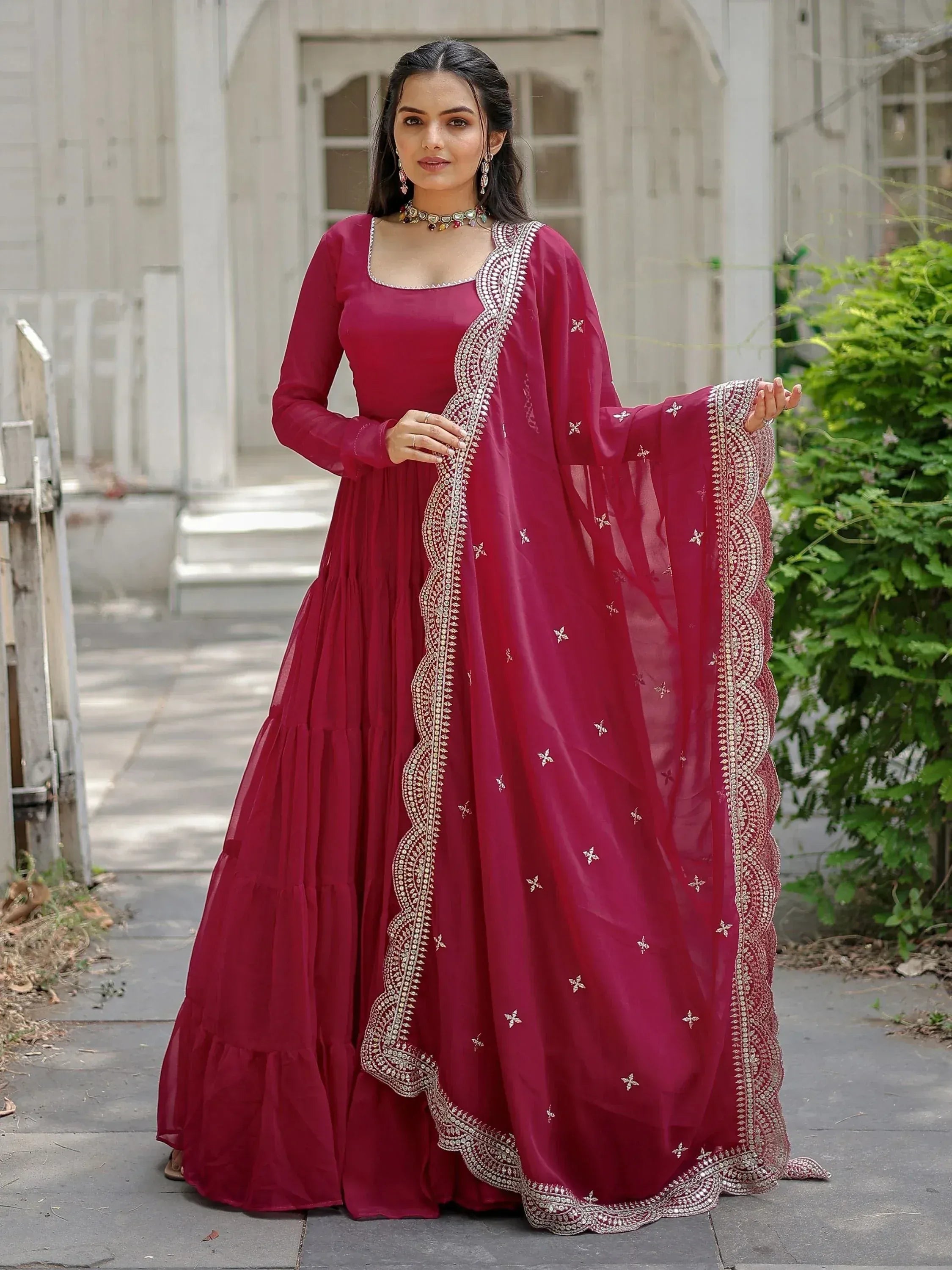 Elegant maroon ethnic gown with silver embroidery, perfect for Indian celebrations and weddings