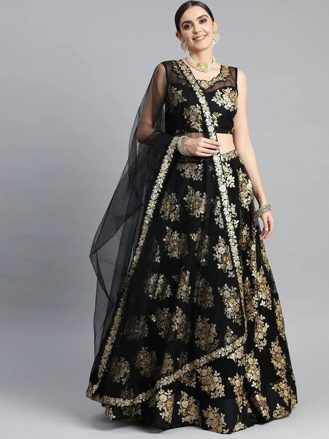 Black and gold embroidered lehenga choli with sheer dupatta, perfect for Indian ethnic wear occasions