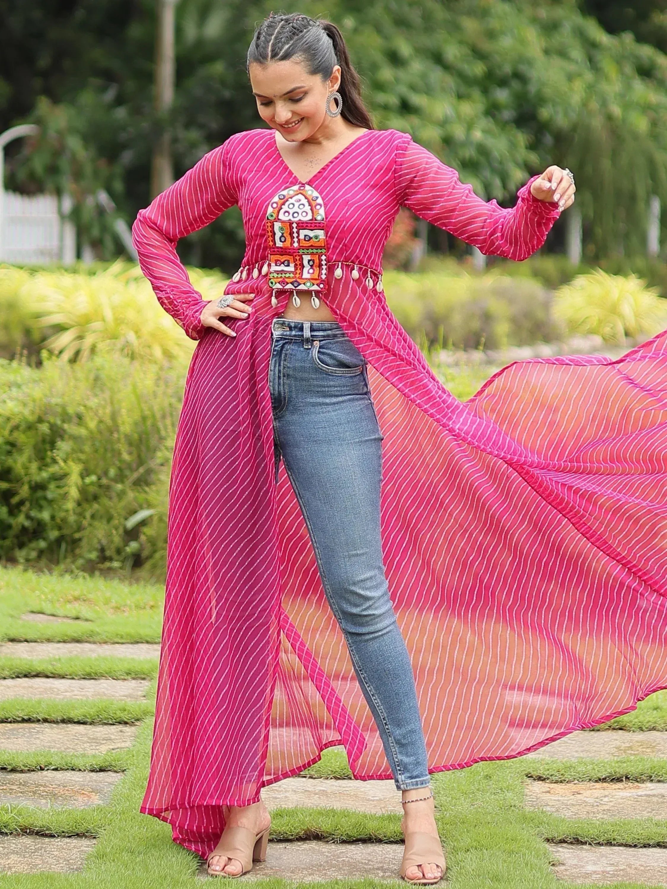 Pink striped ethnic gown with embroidery, paired with jeans, perfect for trendy Indian wear