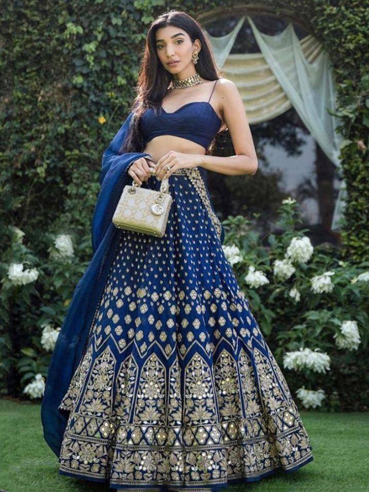 Royal blue lehenga choli with gold embroidery, perfect for weddings and festive occasions